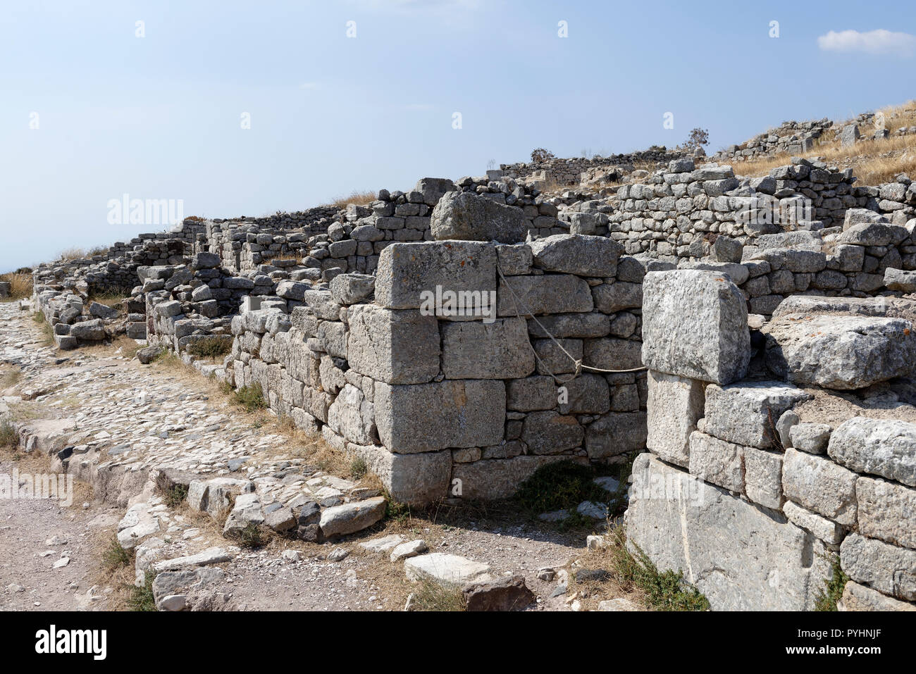 Ruins of a stone building along the main street of the ancient city of Thera, Santorini, Greece. Stock Photo