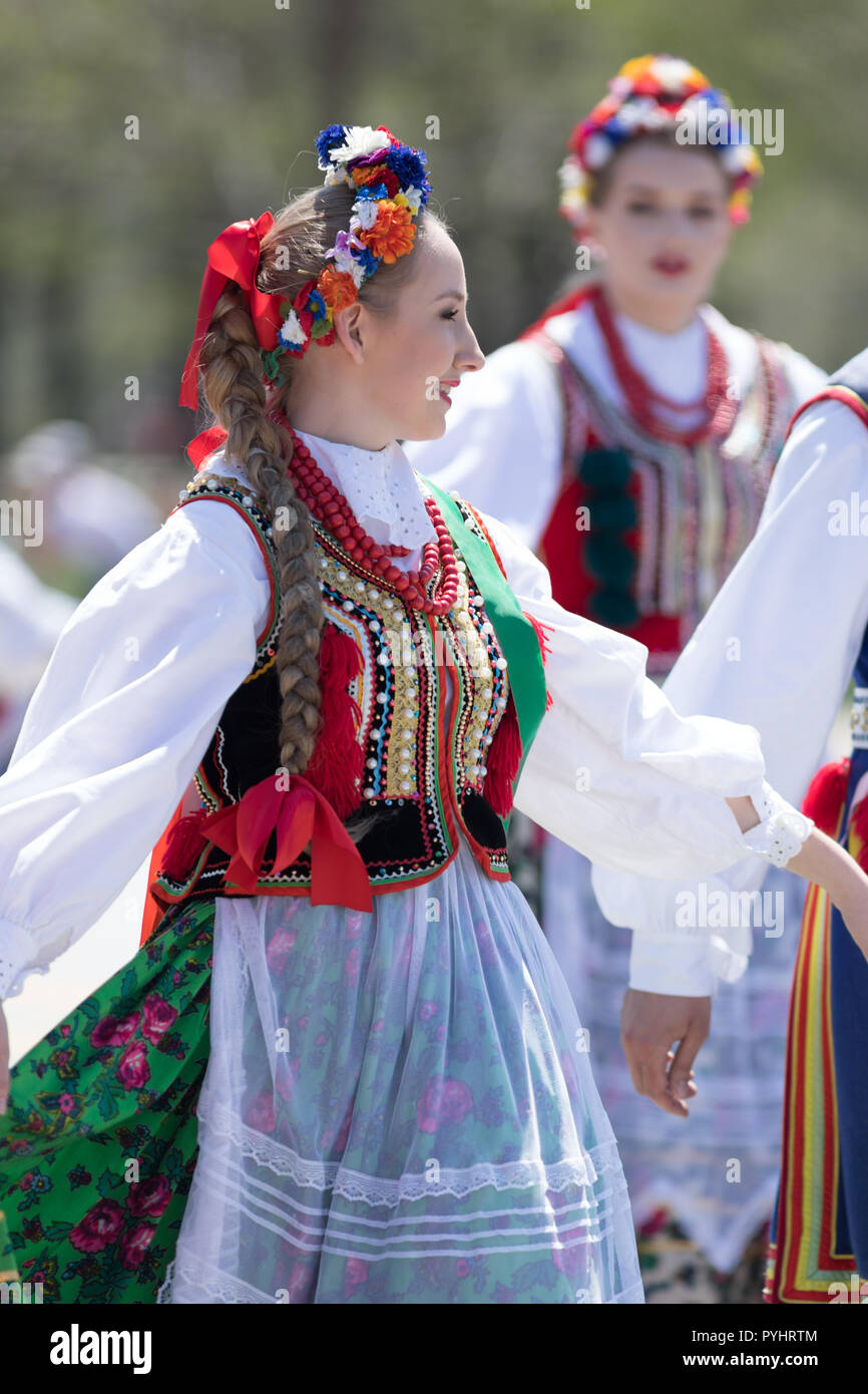 Chicago, Illinois, USA - May 5, 2018: The Polish Constitution Day Parade, Polish woman wearing traditional clothing dancing during the parade Stock Photo