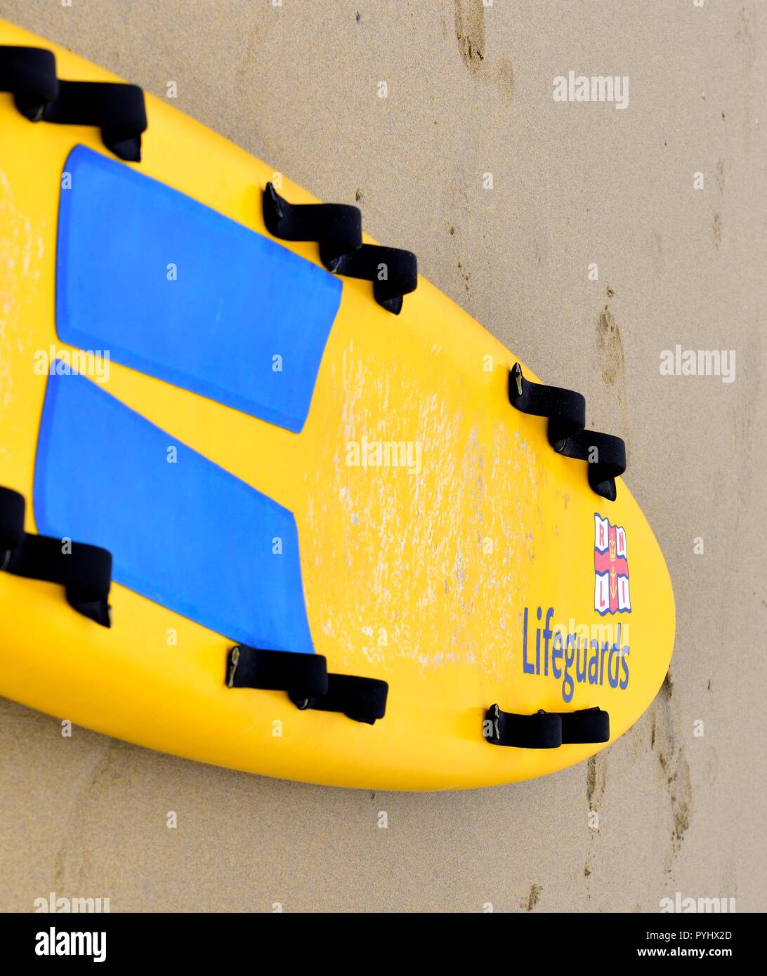 RNLI Lifesaving Surfboard on a UK beach Stock Photo