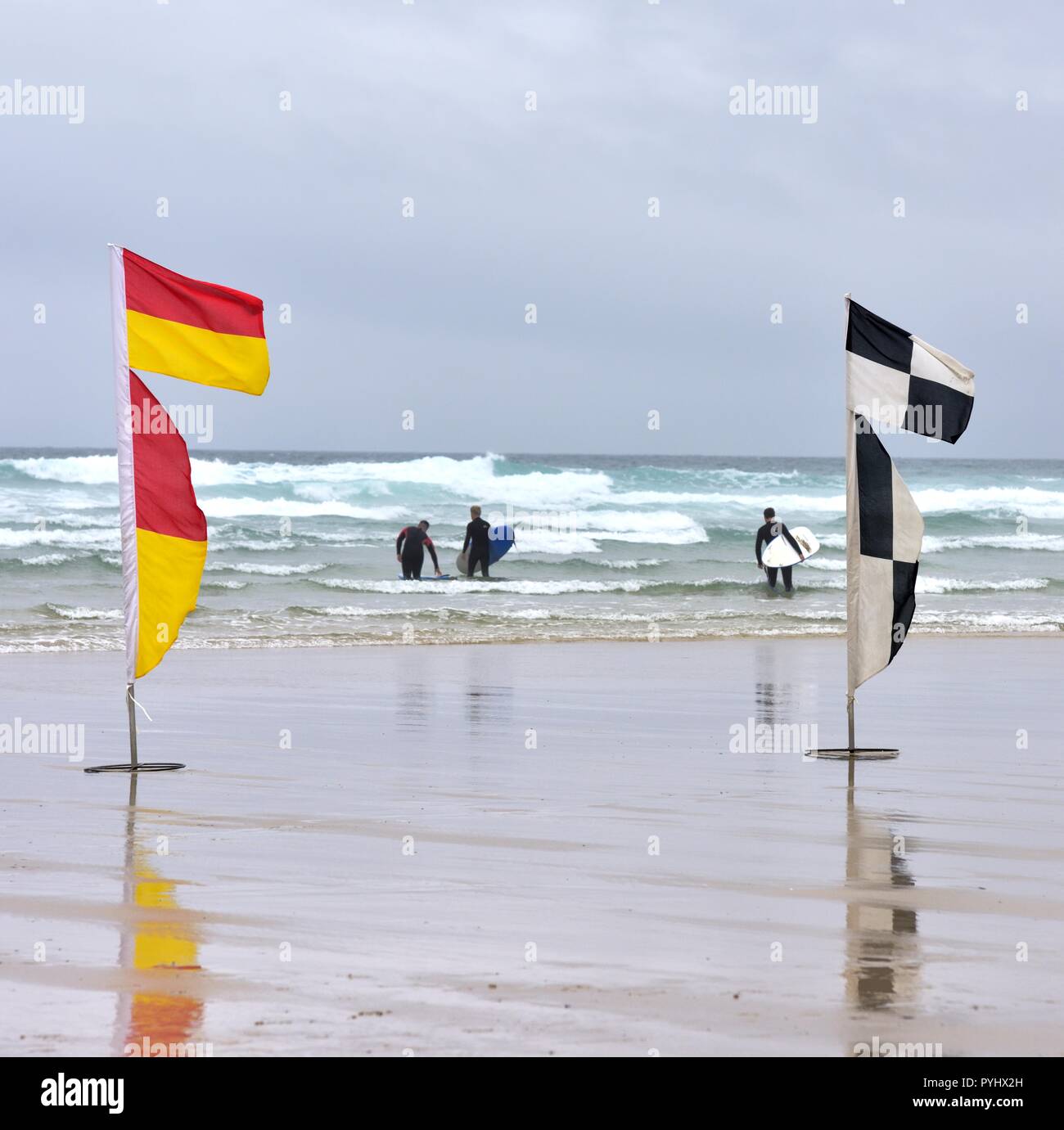 RNLI beach safety flags,Perranporth Beach,Cornwall,England,UK Stock