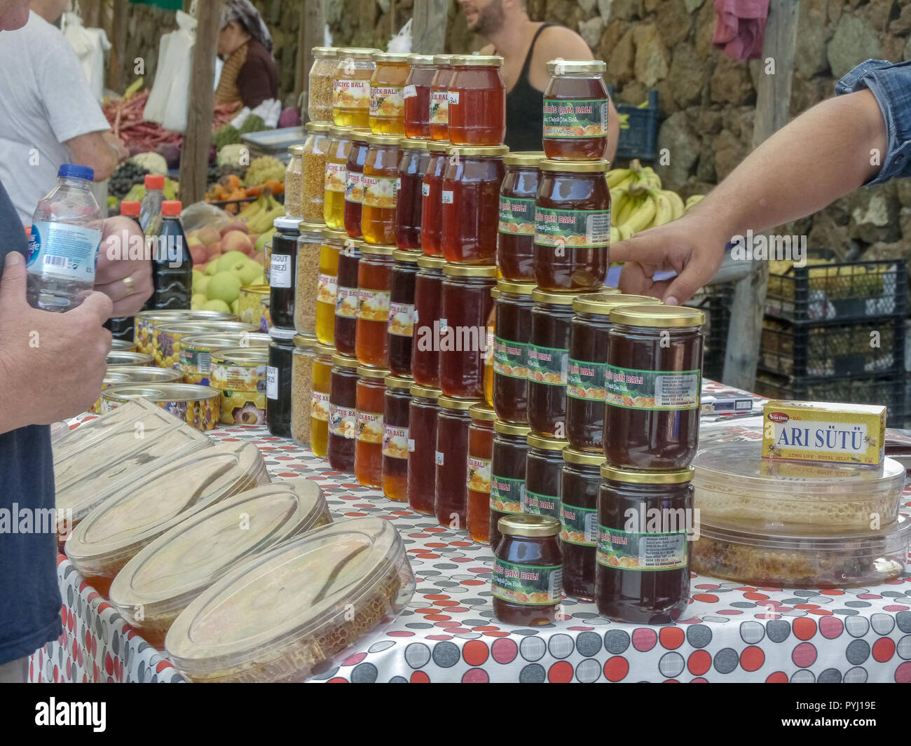 Buying Jars of Turkish Honey at the Market Stock Photo