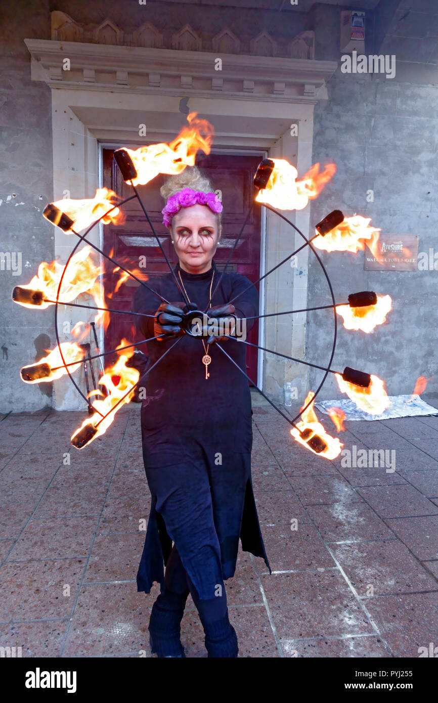 This fire performer kept the cold at bay by juggling with fire whilst entertaining the crowds at Tamfest in Ayr Town Centre. Stock Photo