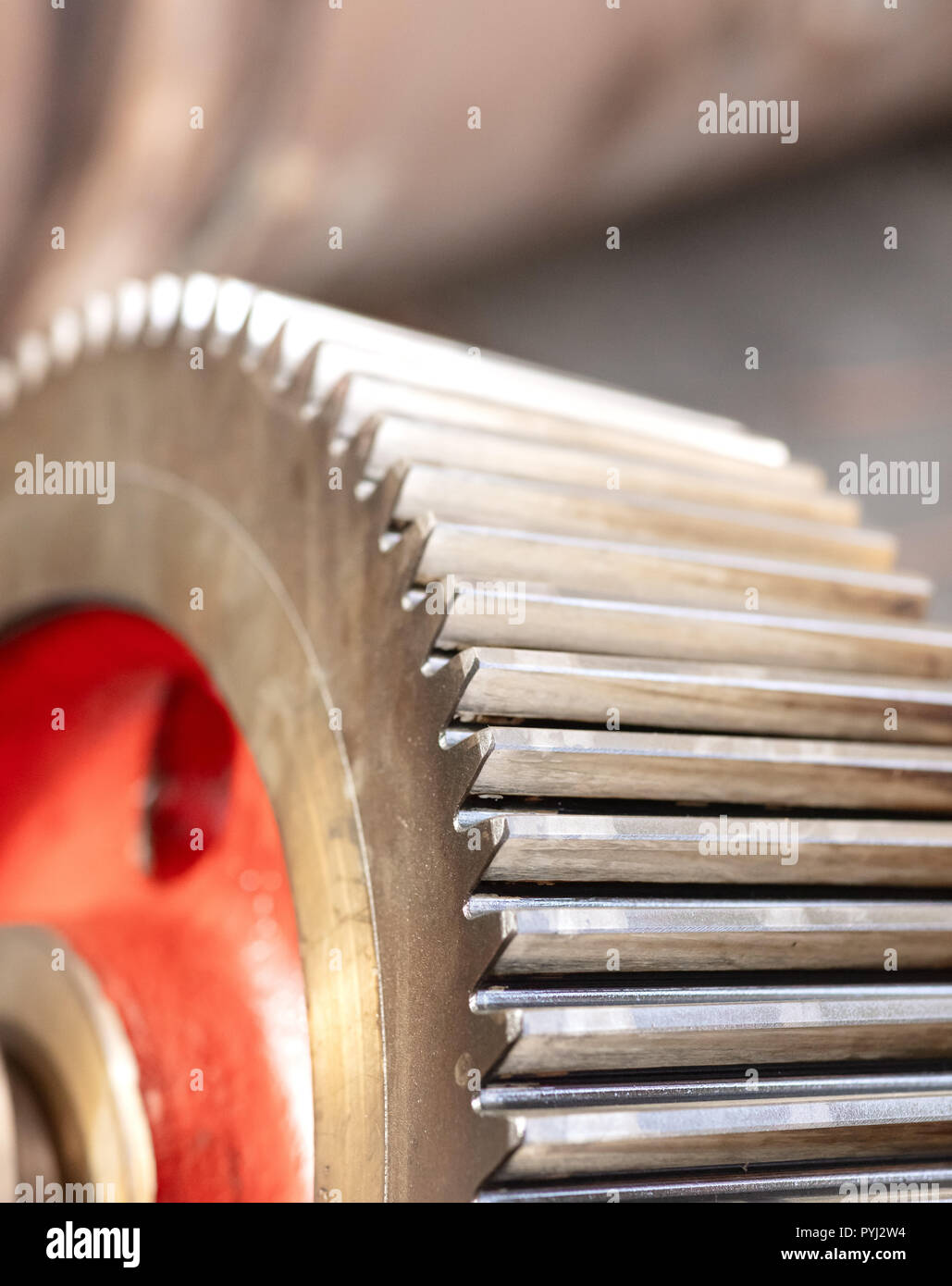 cogwheel of a helical gear in a gearbox, detail of the teeth with a red mark Stock Photo Alamy