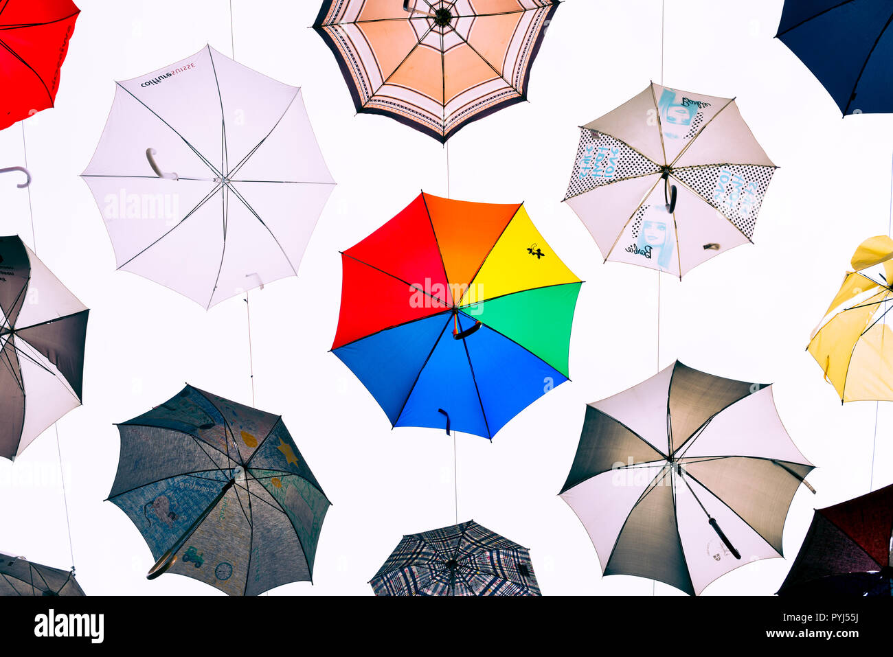 Zurich, Switzerland - March 2017: Art installation with suspended multiple colored umbrellas in Kreis 5 district of Zurich, Switzerland Stock Photo