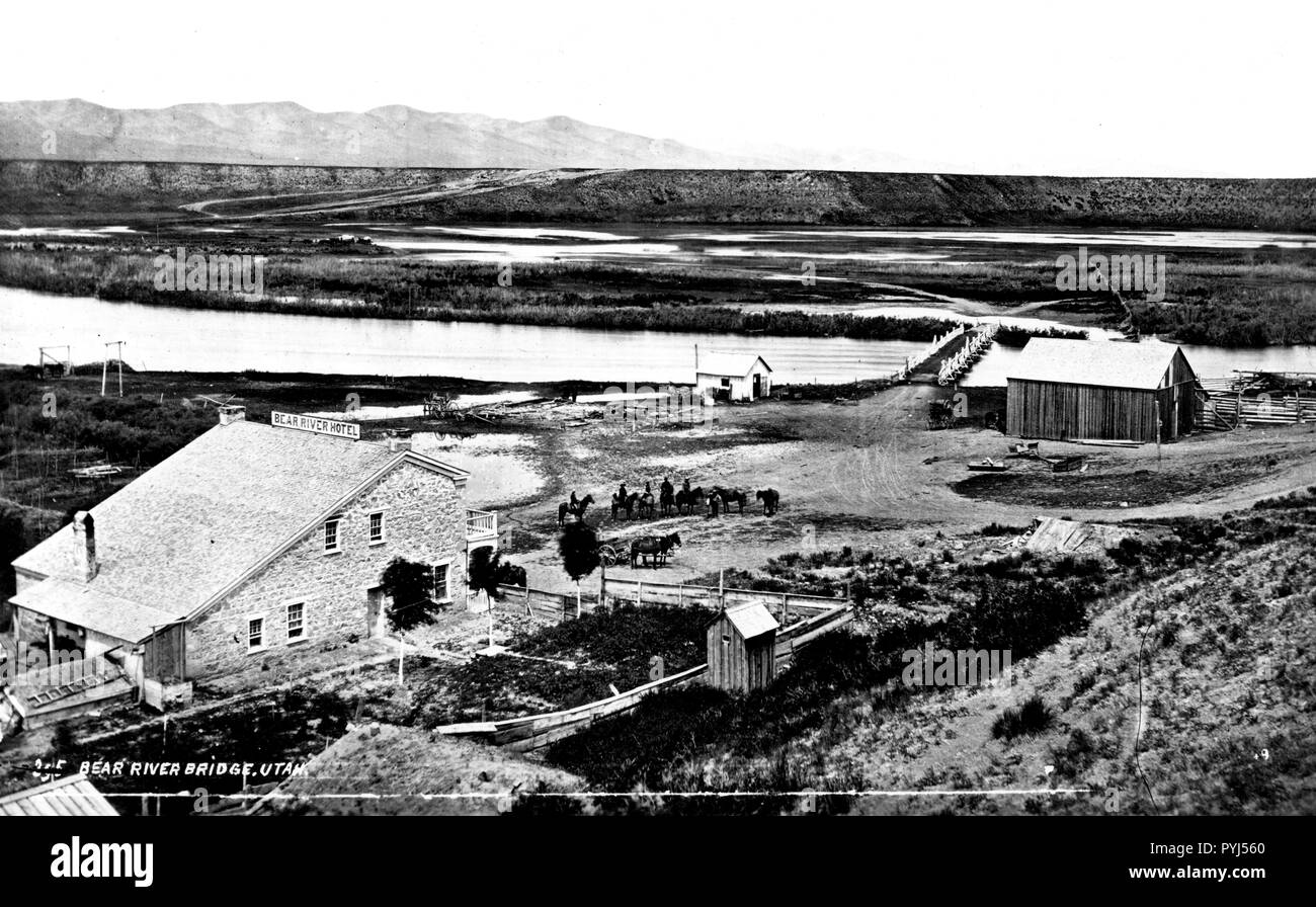 1872 - Bear River Hotel and Bear River Bridge at the crossing on the line of the old stage line from Ogden to Montana (located in Box Elder County, Utah). Stock Photo