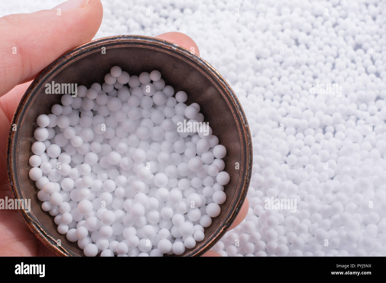 White little polystyrene foam balls as background Stock Photo - Alamy