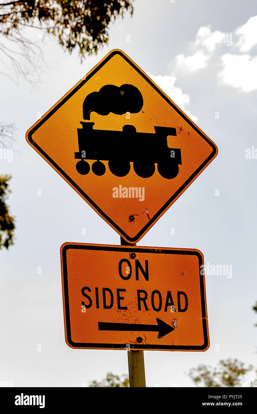 Train or railway or railroad crossing signs found along the road on an Australian outback adventure Stock Photo