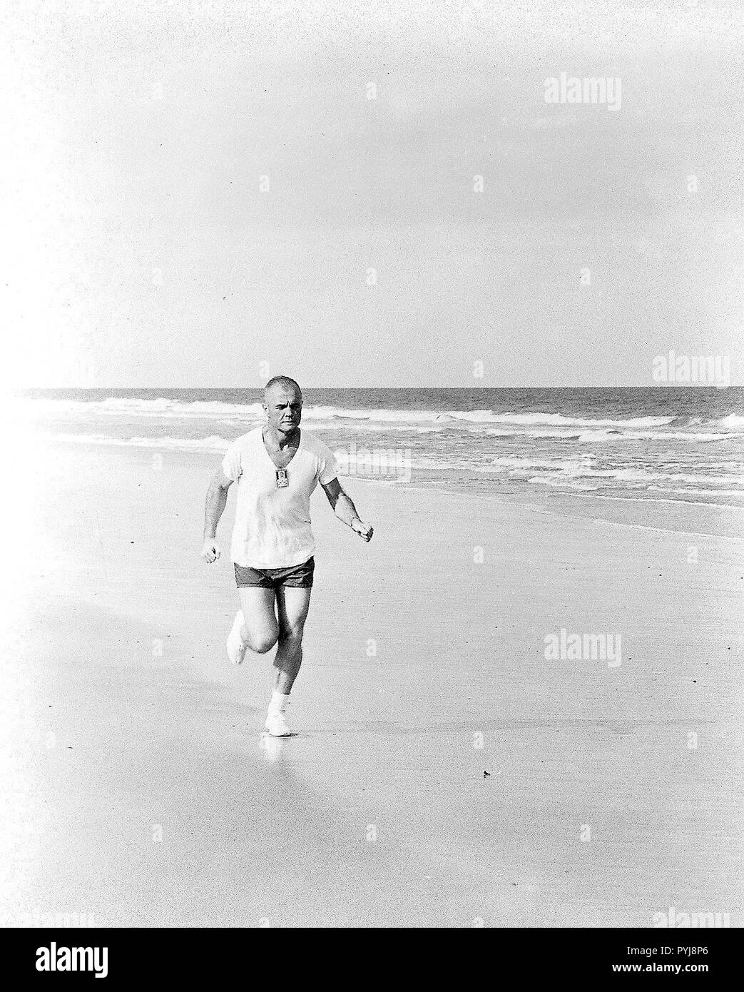 (1962) --- Astronaut John H. Glenn Jr., pilot of the Mercury-Atlas 6 mission, participates in a strict physical training program, as he exemplifies by frequent running. Stock Photo