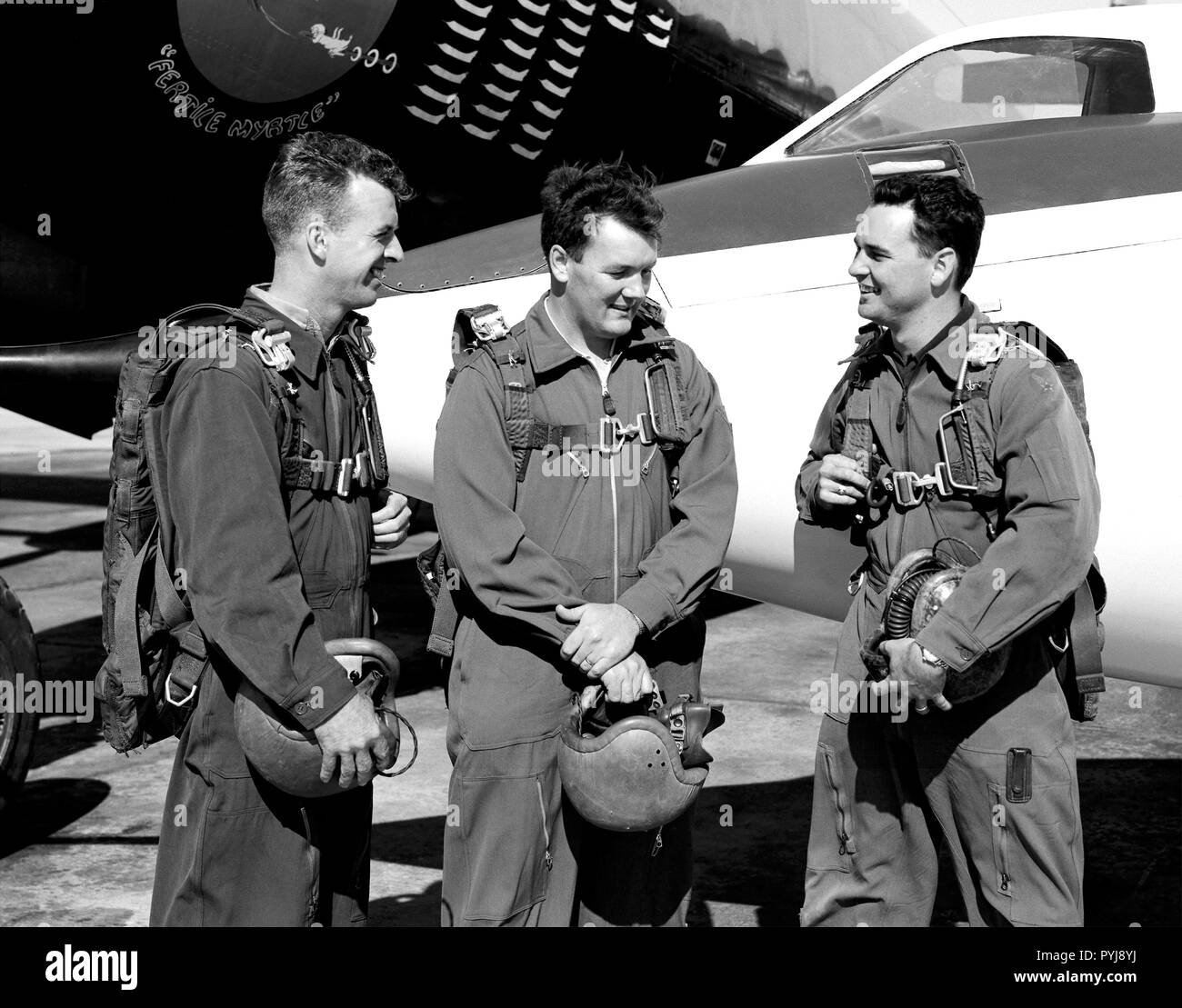 This photo shows test pilots, (Left-Right) Joseph A. Walker, Stanley P. Butchart and Walter P. Jones, standing in front of the Douglas D-558-II Skystreak, in 1952. These three test pilots at the National Advisory Committee for Aeronautics’ High-Speed Flight Research Station probably were discussing their flights in the aircraft. Stock Photo