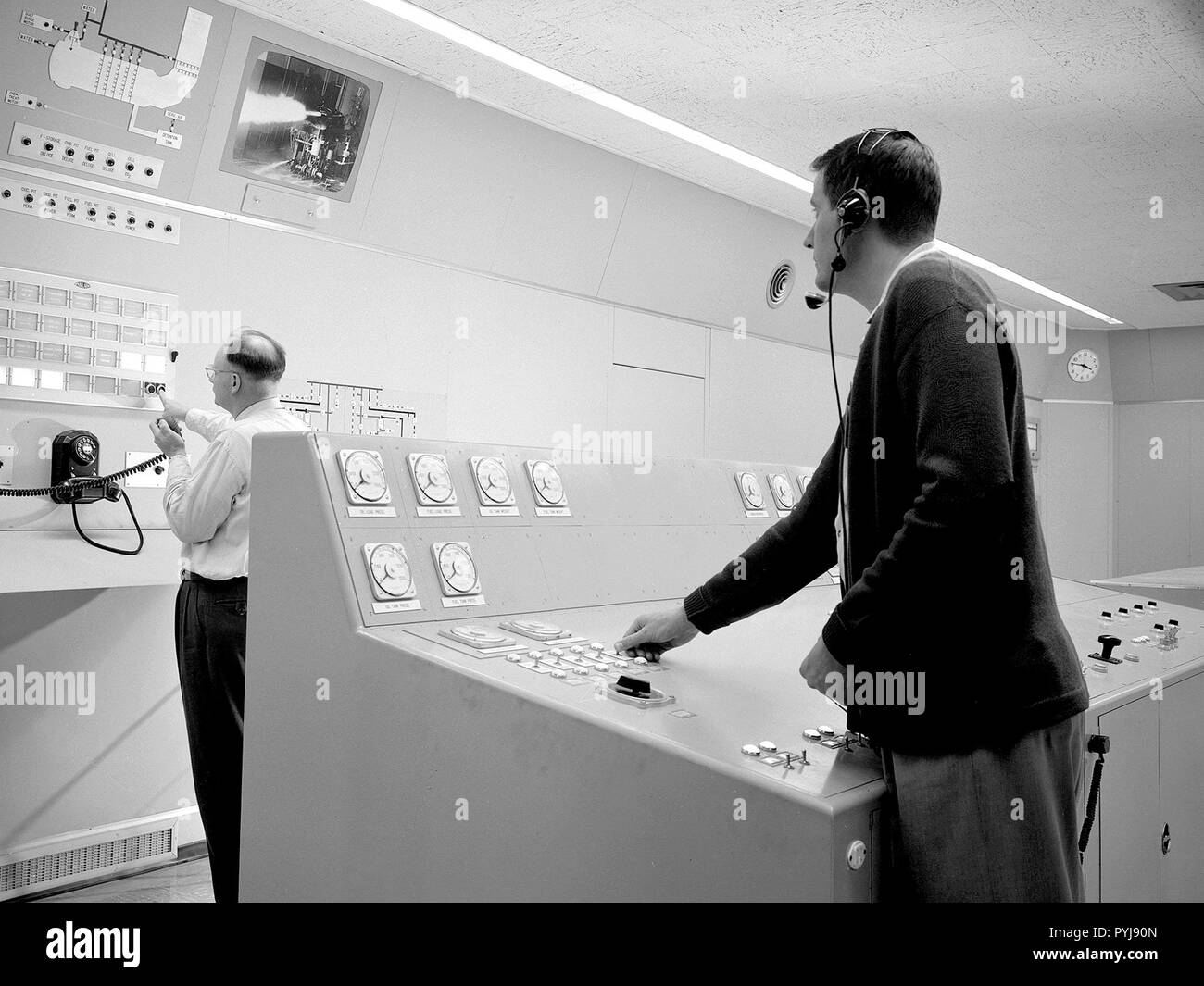 Test engineers monitor an engine firing from the control room of the