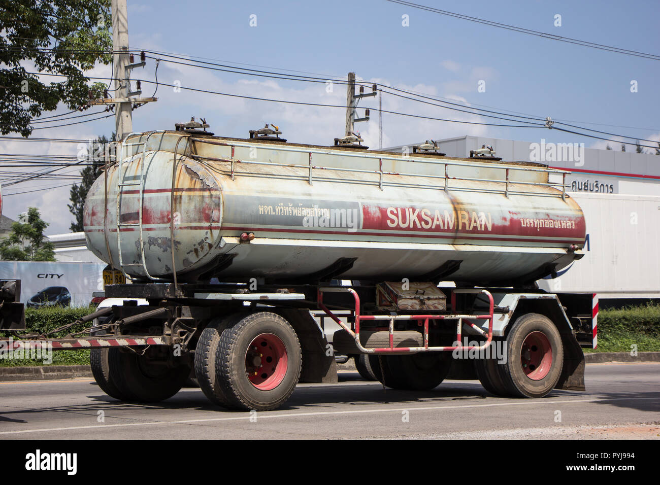 Chiangmai, Thailand - September 25 2018: Trailer Truck and Palm Oil Tank Truck of Suksamran Transport. Photo at road no 121 about 8 km from downtown C Stock Photo