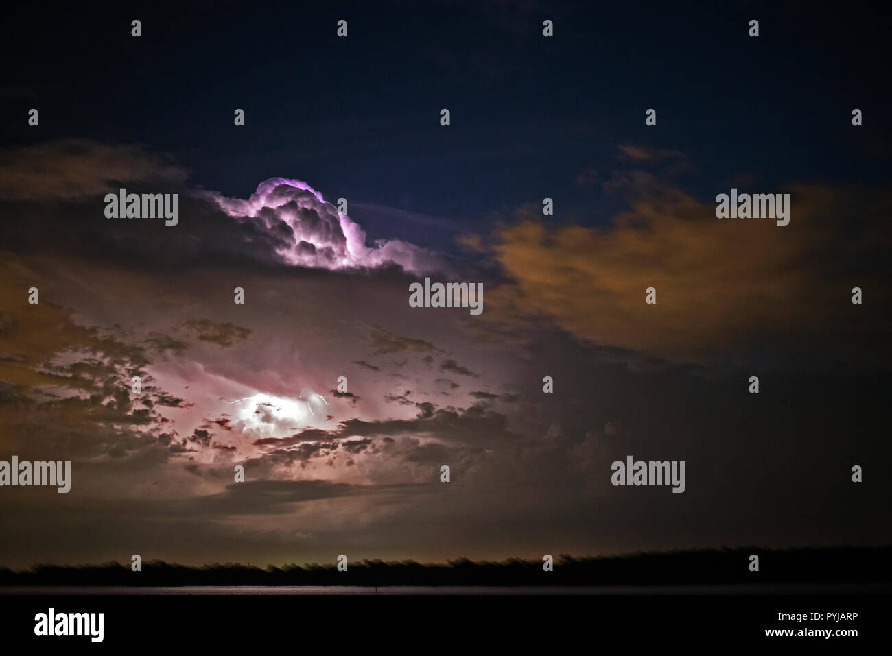 Impressive thunderstorm and lightning at night over Moreton Bay, Queensland, Australia. Stock Photo