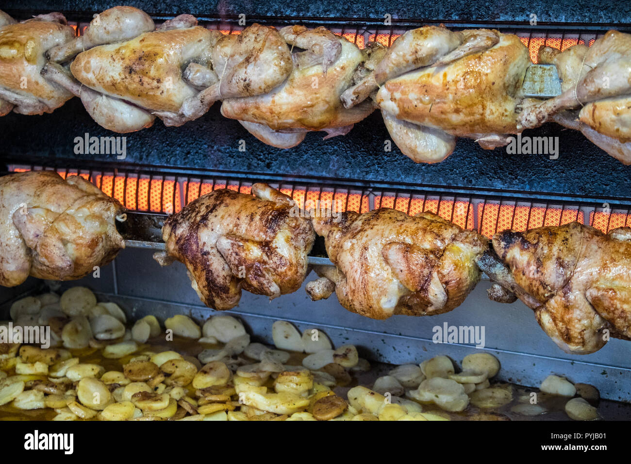 Spit roasted chickens hires stock photography and images Alamy