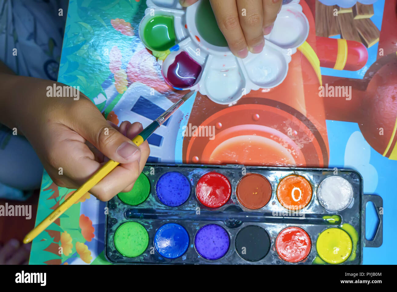 The children are learning to mix colors. It is homework Stock Photo - Alamy