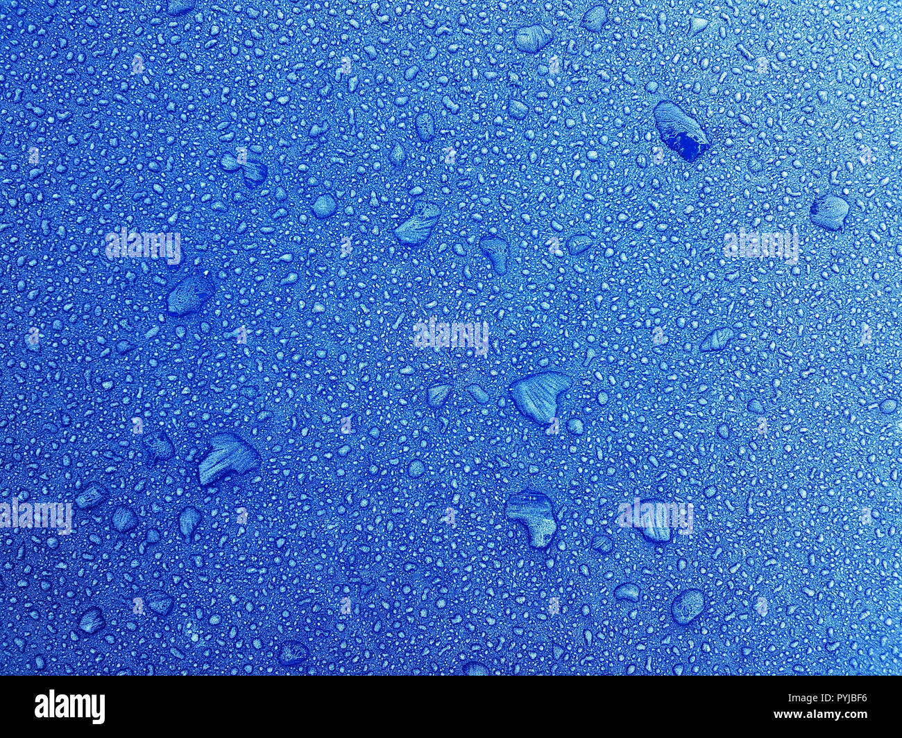 Frozen Water Droplets on a Frosted Metallic Background Stock Photo - Alamy