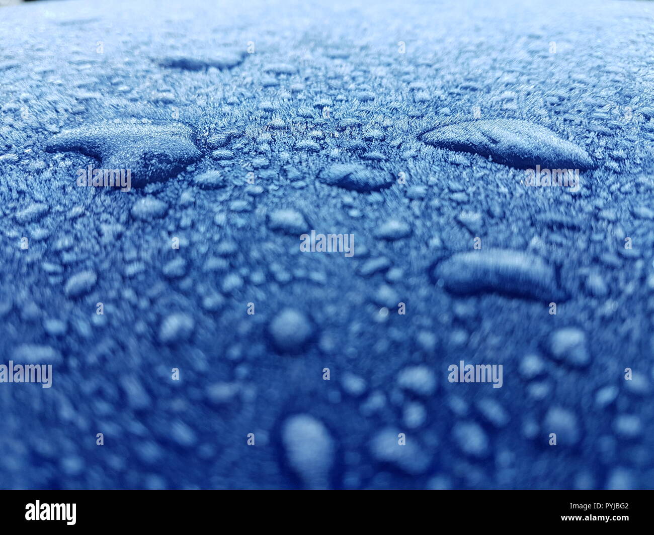 Closeup Frozen Water Droplets on a Metallic Frost covered Car Roof ...