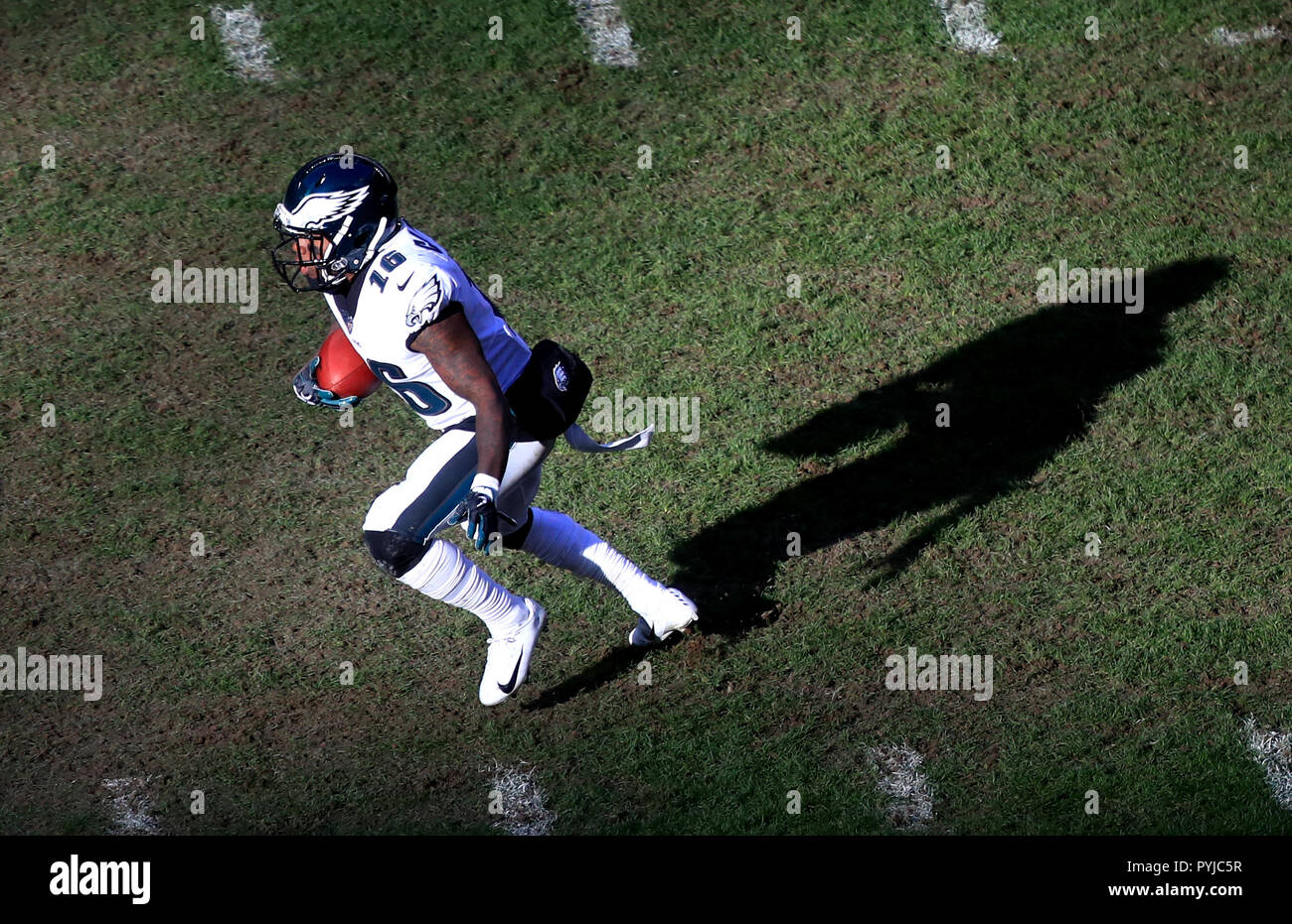 August 19, 2023: Miami Dolphins running back Salvon Ahmed (26) carries the  ball as Houston Texans safety Jimmie Ward (1) looks on after missing a  tackle during an NFL preseason game between