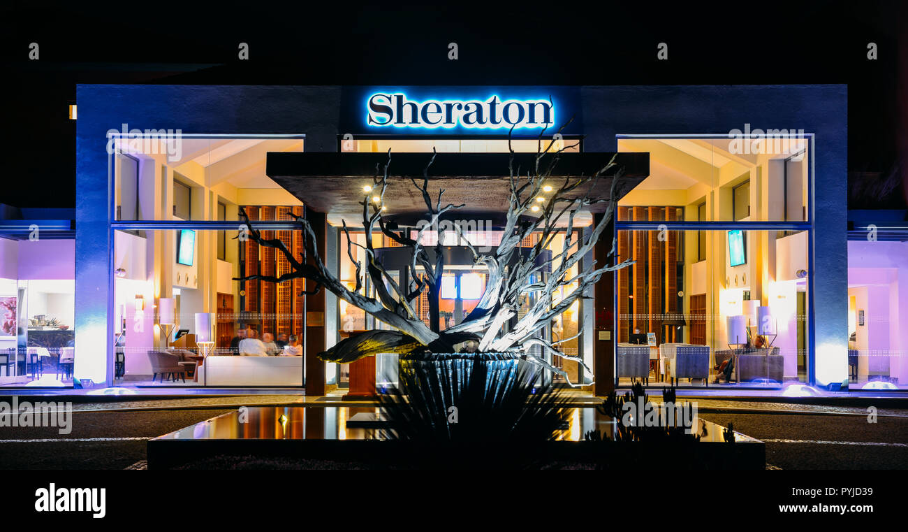 Cascais, Portugal - Oct 27, 2018: Main entrance of luxurious Sheraton hotel illuminated at night in Cascais, Portugal Stock Photo