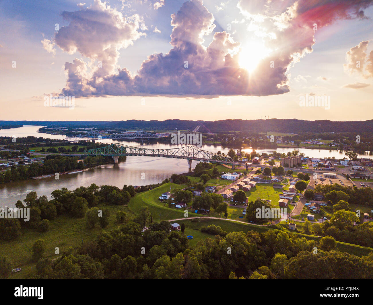 An aerial view of the convergence of the Ohio and Kanawha Rivers at Point Pleasant, West Virginia below the setting sun. Stock Photo