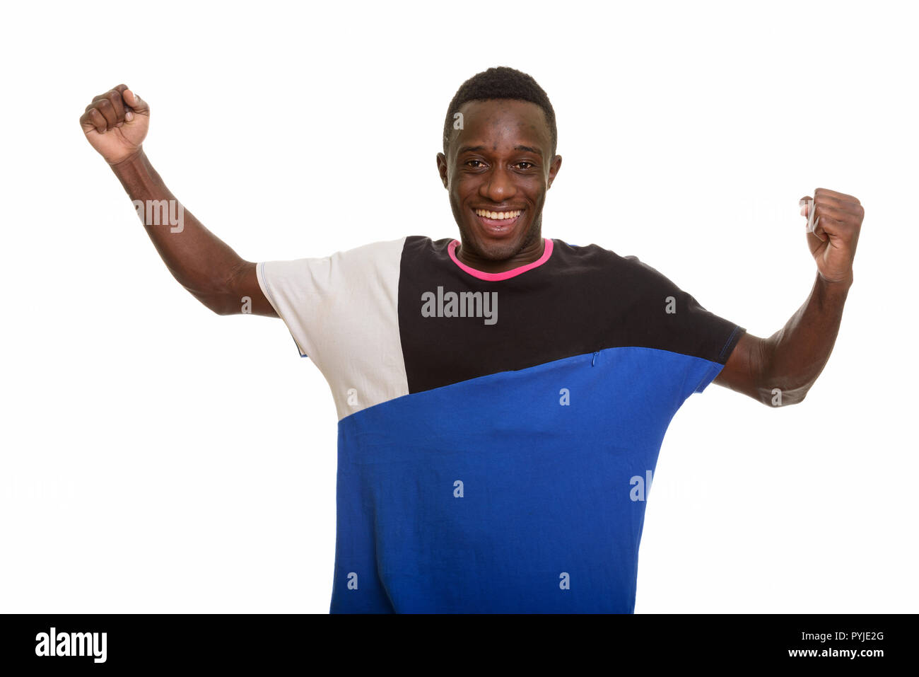 Young happy African man smiling and looking excited Stock Photo - Alamy