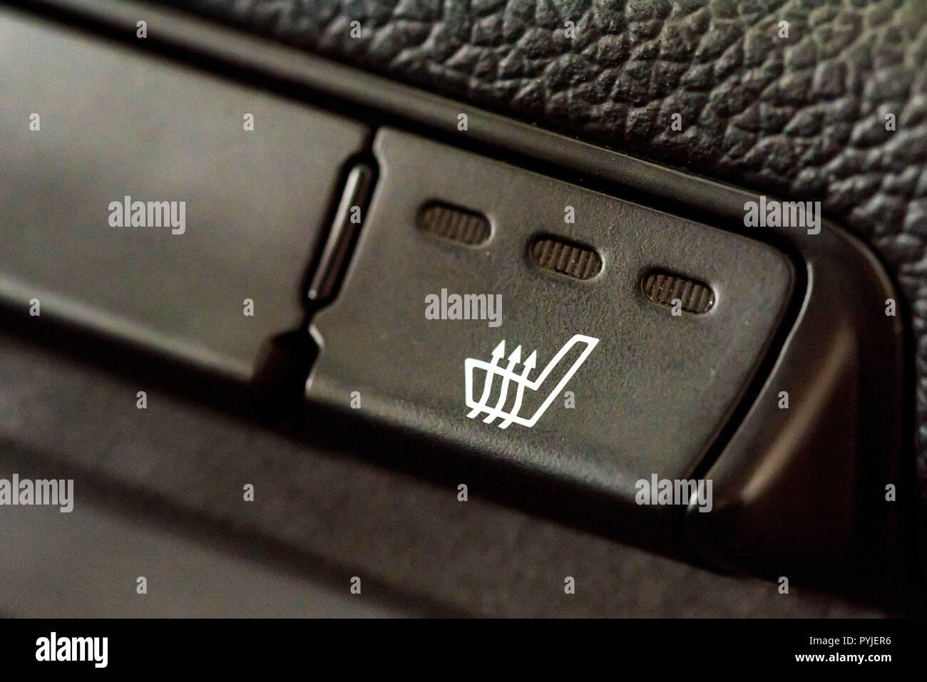 Car seat heating button in car interior Stock Photo Alamy