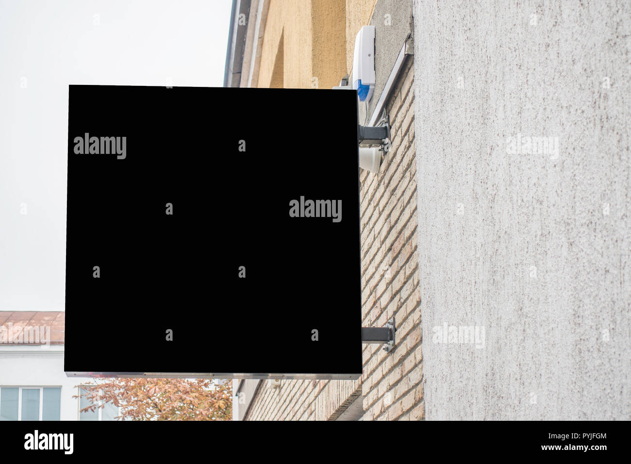 Mock up of blank black rectangular signboard on the wall Stock Photo ...