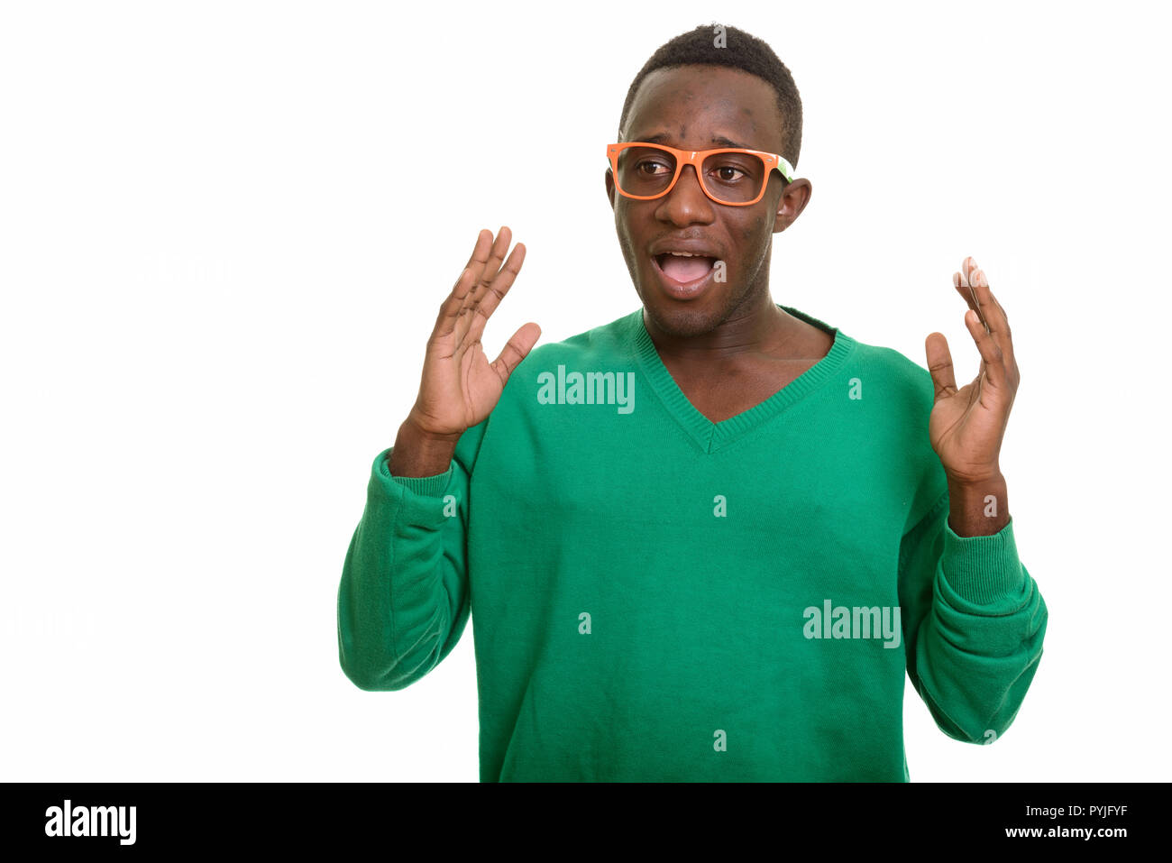 Portrait of young African man looking excited Stock Photo