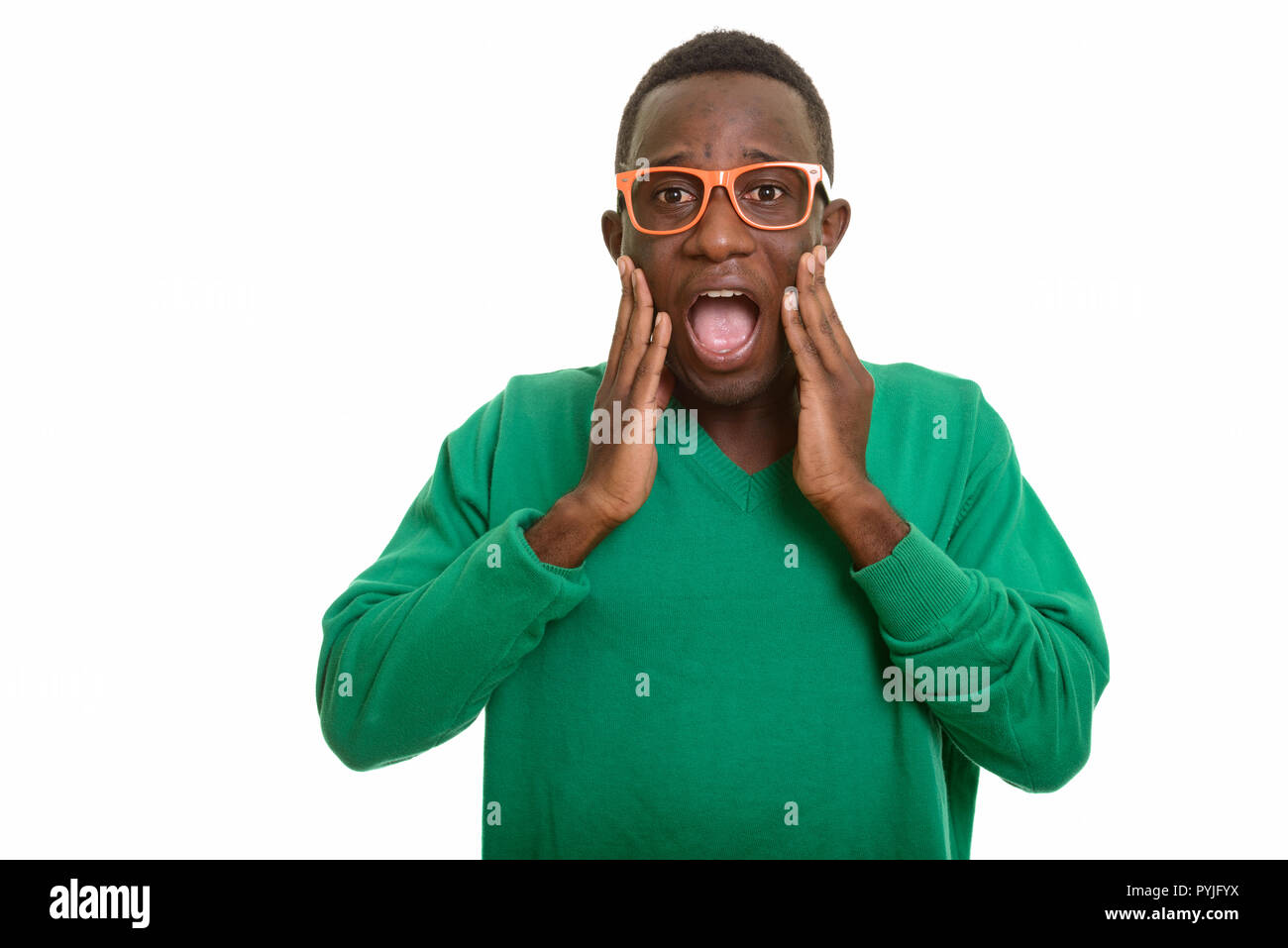 Portrait of young African man looking shocked Stock Photo - Alamy