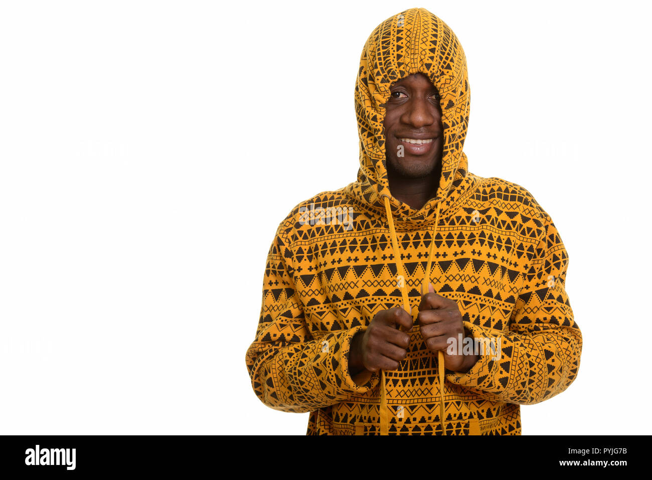 Young happy African man smiling and playing with hoodie  Stock Photo