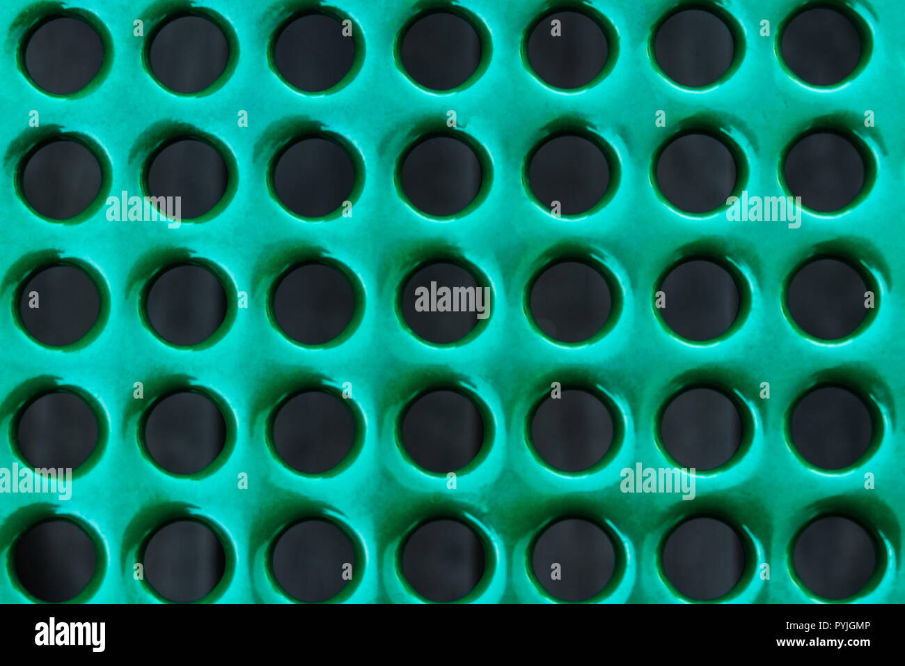 Green pattern with wholes. Texture - Metal enameled. Thirty five wholes Stock Photo