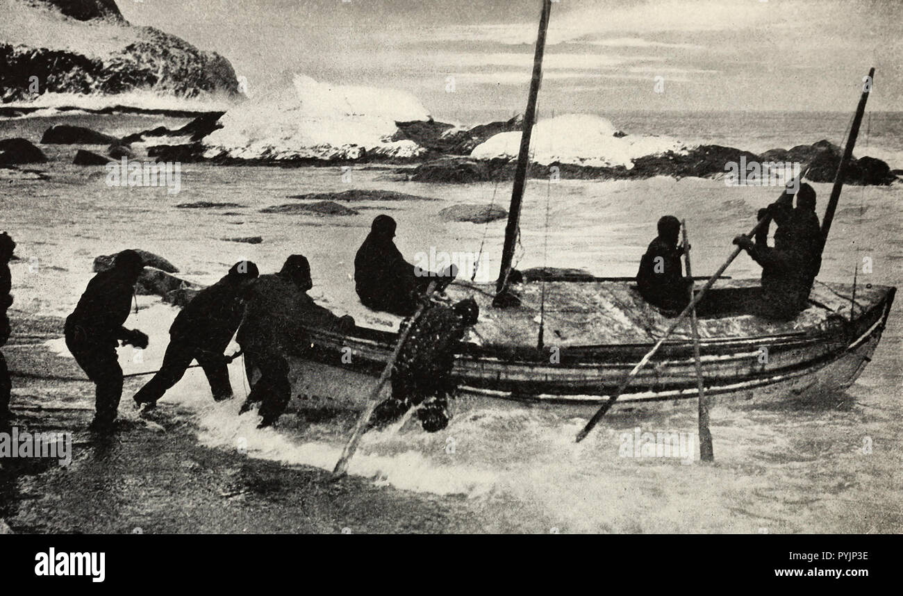 Launching the James Caird on the relief voyage to South Georgia during the Shackleton Expedition Stock Photo