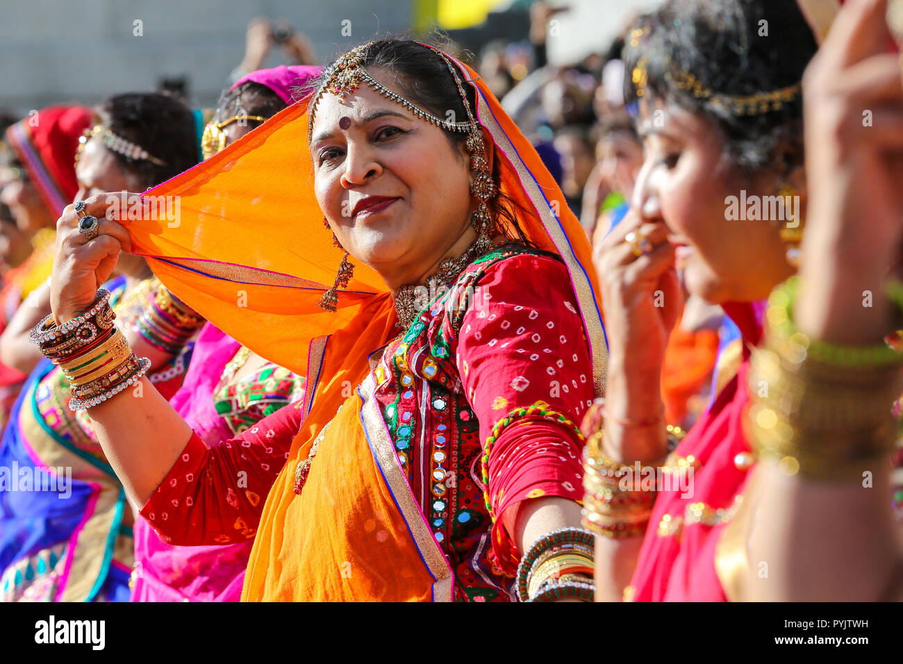 Trafalgar Square, London, UK. 28 Oct 2018 - Performers during the Mass Ghoomar Dance - a traditional Gujarati folk dance of the Bhil tribe performed in worship to Goddess Sarasvati, were the dancers twirling in and out of a wide circle.   Hundreds of Hindus, Sikhs, Jains and people from all communities attend Diwali celebrations in London - festival of light, Diwali in London is celebrated each year with a free concert of traditional religious and contemporary Asian music and dance.  Credit: Dinendra Haria/Alamy Live News Stock Photo