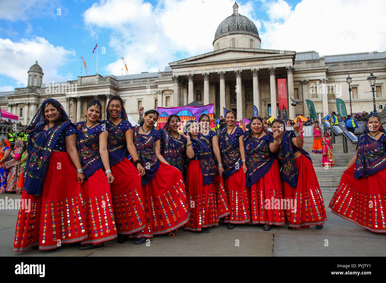 Trafalgar Square, London, UK. 28 Oct 2018 - Performers during the Mass Ghoomar Dance - a traditional Gujarati folk dance of the Bhil tribe performed in worship to Goddess Sarasvati, were the dancers twirling in and out of a wide circle.   Hundreds of Hindus, Sikhs, Jains and people from all communities attend Diwali celebrations in London - festival of light, Diwali in London is celebrated each year with a free concert of traditional religious and contemporary Asian music and dance.  Credit: Dinendra Haria/Alamy Live News Stock Photo