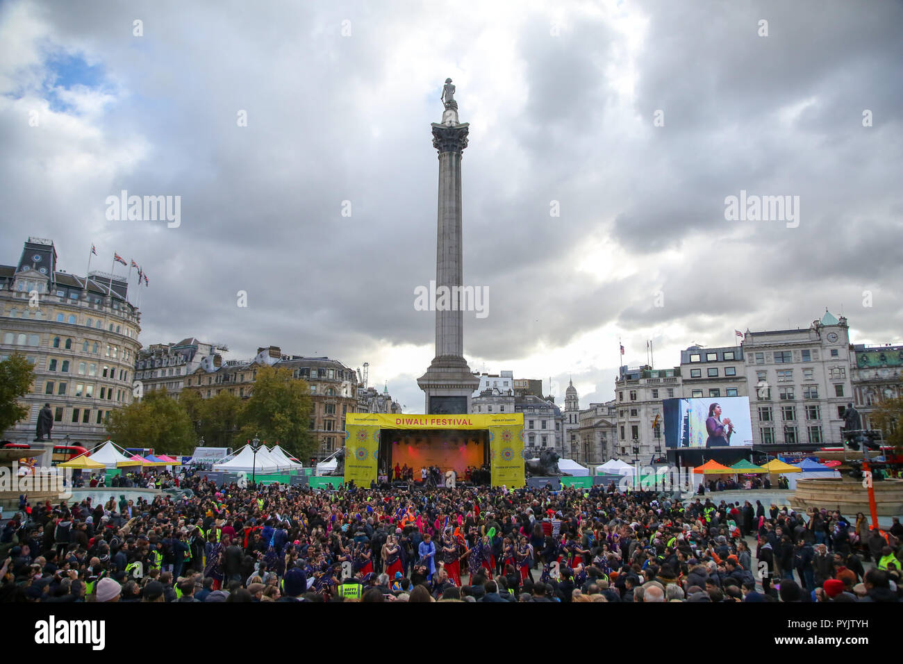 Trafalgar Square, London, UK. 28 Oct 2018 - Members of public joins the performers during the Mass Ghoomar Dance - a traditional Gujarati folk dance of the Bhil tribe performed in worship to Goddess Sarasvati, were the dancers twirling in and out of a wide circle.   Hundreds of Hindus, Sikhs, Jains and people from all communities attend Diwali celebrations in London - festival of light, Diwali in London is celebrated each year with a free concert of traditional religious and contemporary Asian music and dance.  Credit: Dinendra Haria/Alamy Live News Stock Photo