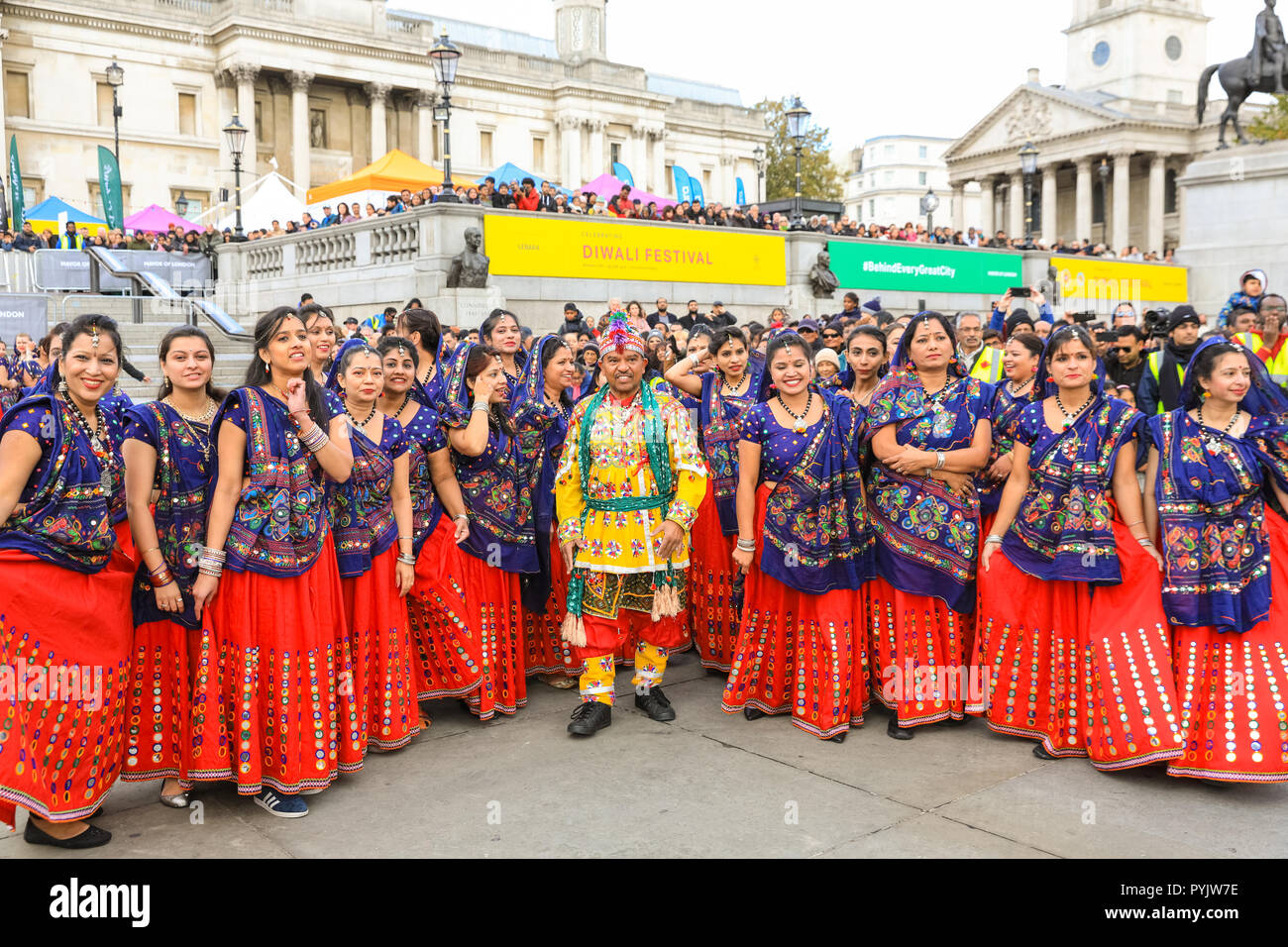 Trafalgar Square, London, UK, 28th Oct 2018. The Ghoomar Dance, a  traditional folk dance from Rajastan, is performed by 120 performers from all over London. Diwali, the Hindu, Sikh and Jain festival of lights, is celebrated in London’s Trafalgar Square with dance and music performances,crafts, workshops, food and stalls. Credit: Imageplotter News and Sports/Alamy Live News Stock Photo