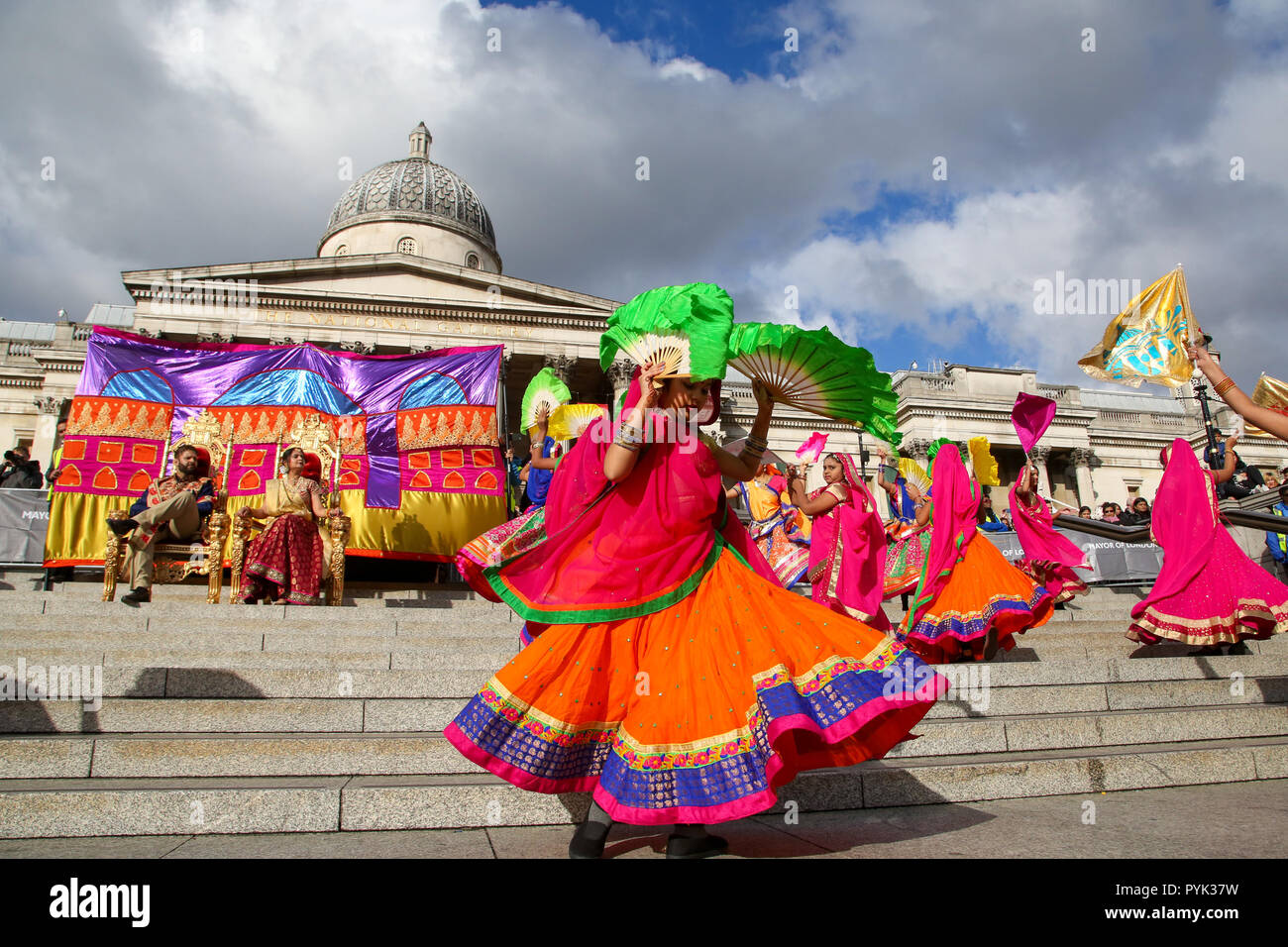Trafalgar Square, London, UK. 28 Oct 2018 - Performers during the Mass Ghoomar Dance - a traditional Gujarati folk dance of the Bhil tribe performed in worship to Goddess Sarasvati, were the dancers twirling in and out of a wide circle.  Hundreds of Hindus, Sikhs, Jains and people from all communities attend Diwali celebrations in London - festival of light, Diwali in London is celebrated each year with a free concert of traditional religious and contemporary Asian music and dance.  Credit: Dinendra Haria/Alamy Live News Stock Photo