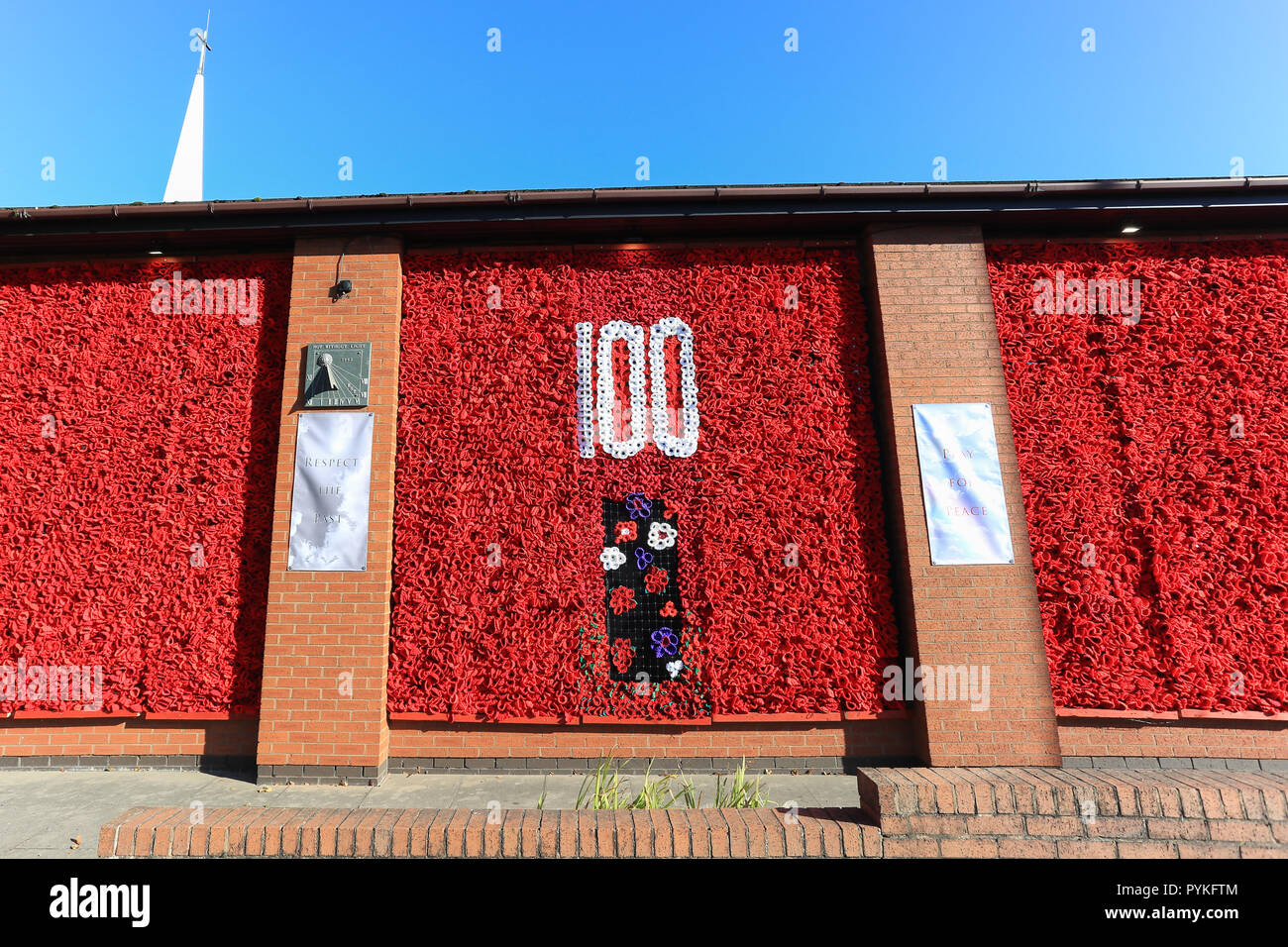 Bromsgrove, Worcestershire, UK. 29th October, 2018. A stunning display featuring 12,500 hand-knitted poppies adorns Bromsgrove Methodist Church walls. The centrepiece has the number '100' made with white wool poppies, a symbol of peace. Purple poppies also feature which commemorates the many animals - mainly horses - who were in the First World War. The poppies came from all over the UK, but most were made by local people in Bromsgrove. Peter Lopeman/Alamy Live News Stock Photo