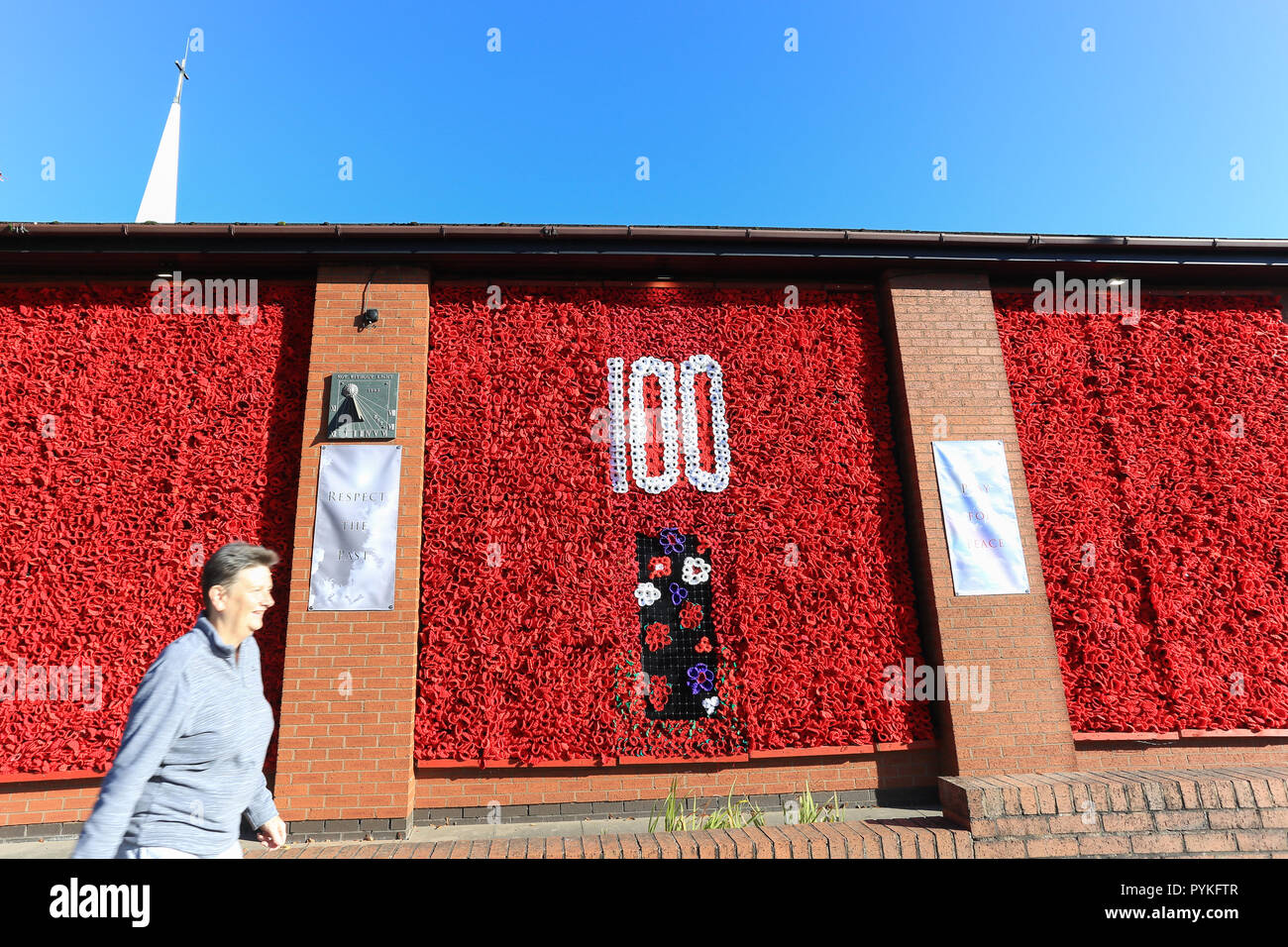 Bromsgrove, Worcestershire, UK. 29th October, 2018. A stunning display featuring 12,500 hand-knitted poppies adorns Bromsgrove Methodist Church walls. The centrepiece has the number '100' made with white wool poppies, a symbol of peace. Purple poppies also feature which commemorates the many animals - mainly horses - who were in the First World War. The poppies came from all over the UK, but most were made by local people in Bromsgrove. Peter Lopeman/Alamy Live News Stock Photo