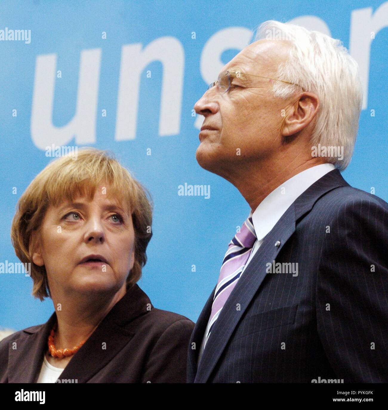 Berlin, Wednesday. 17th Aug, 2005. (dpa) - Angela Merkel (L), chairwoman of the Christian Democratic Union (CDU) and candidate for the German chancellorship looks at chairman of the CSU Edmund Stoiber during a press conference in Berlin, Wednesday, 17 August 2005. The CDU introduced the members of the so-called 'competence team' for the German Bundestag election in September. | usage worldwide Credit: dpa/Alamy Live News Stock Photo