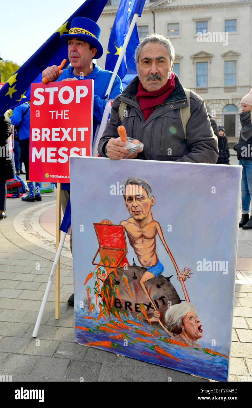 London 29th October 2018. The Prime Minister and Chancellor of the Exchequer leave Downing Street before Philip Hammond deliveres his Budget to Parliament. Artist Kaya Mar and anti-Brexit campaiger Steve Bray demonstrate outside Parliament Credit: PjrFoto/Alamy Live News Stock Photo