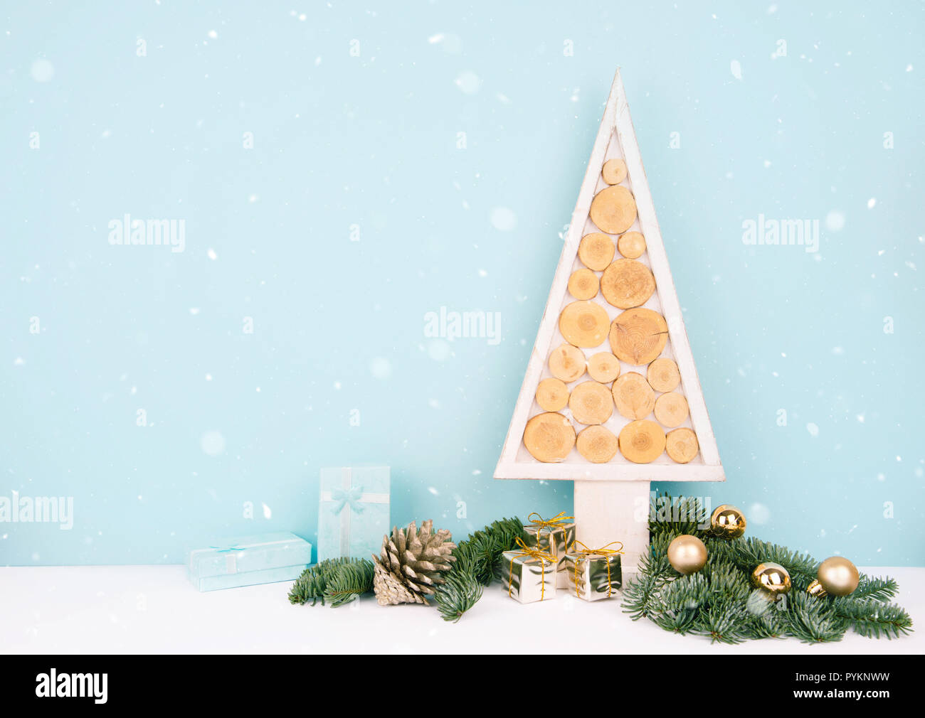 Christmas wooden tree over dark light blue background Stock Photo - Alamy