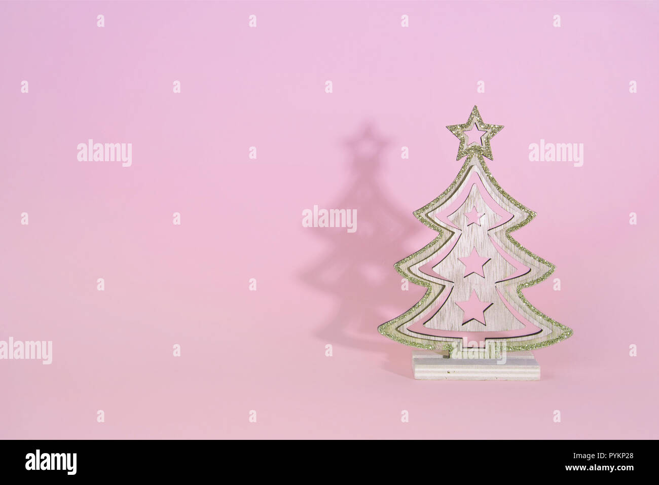 Christmas wooden tree over light blue background Stock Photo - Alamy