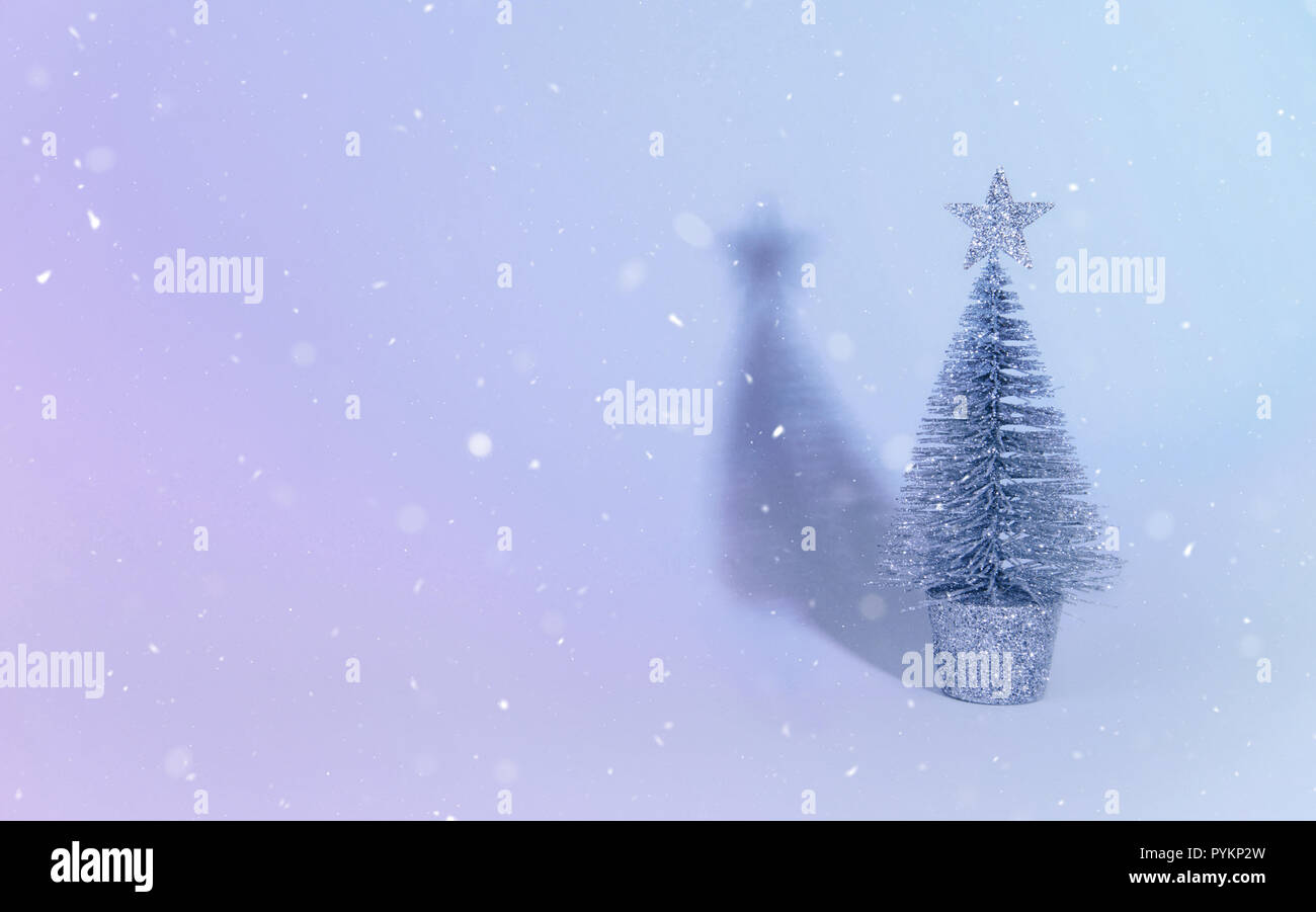 Christmas tree over light blue background Stock Photo - Alamy