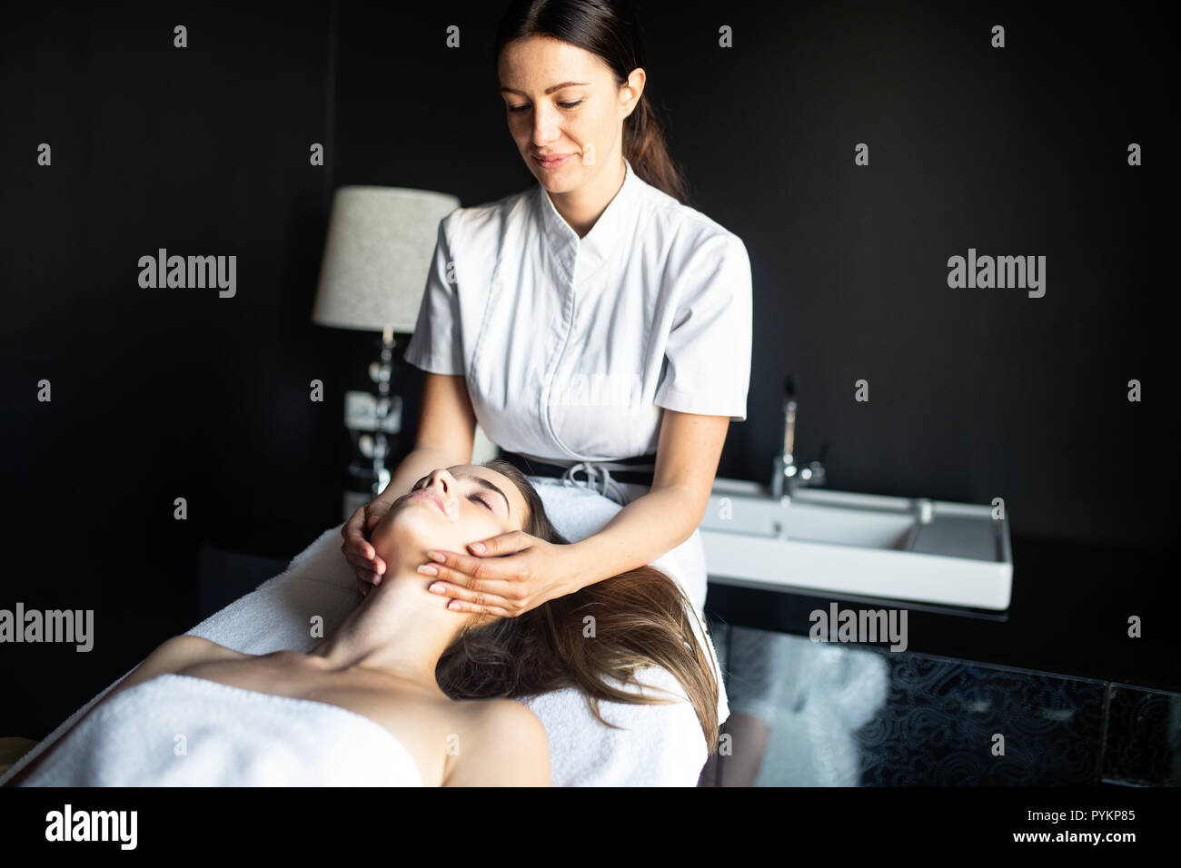 Woman enjoying skin and face treatment and massage Stock Photo