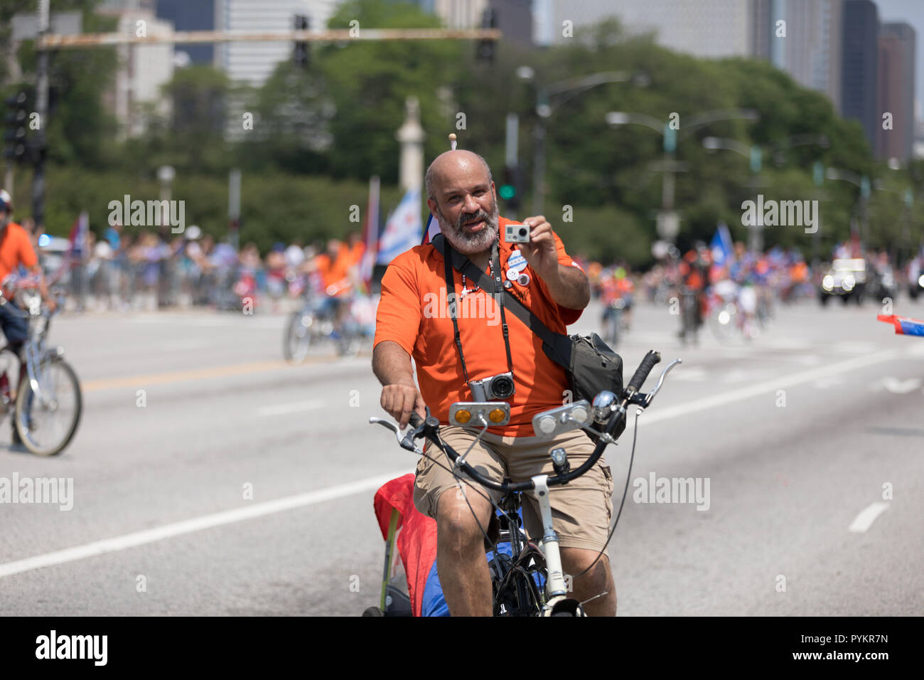 Chicago, Illinois, USA - June 16, 2018: The Puerto Rican Day Parade, Member of the Classic Cruisers Bicycle Club riding a bicycle with the puerto rica Stock Photo