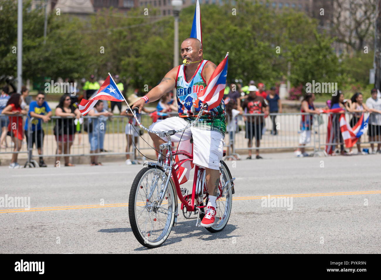 Chicago, Illinois, USA - June 16, 2018: The Puerto Rican Day Parade, Members of the Classic Cruisers Bicycle Club riding a bicycles with the puerto ri Stock Photo