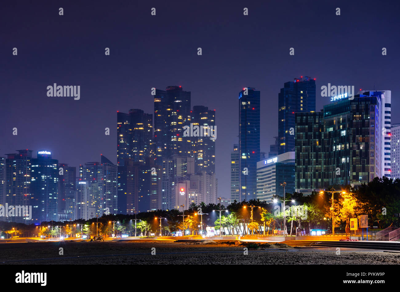 Haeundai Beach at night with skyscrapers of the city lit up in the dark. Haeundae, Busan, south Korea. Stock Photo