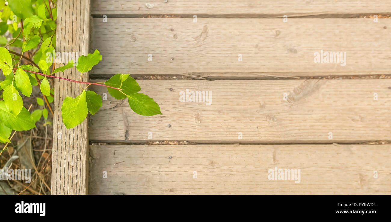 Wooden bridge over a dry rocky terrain Stock Photo - Alamy