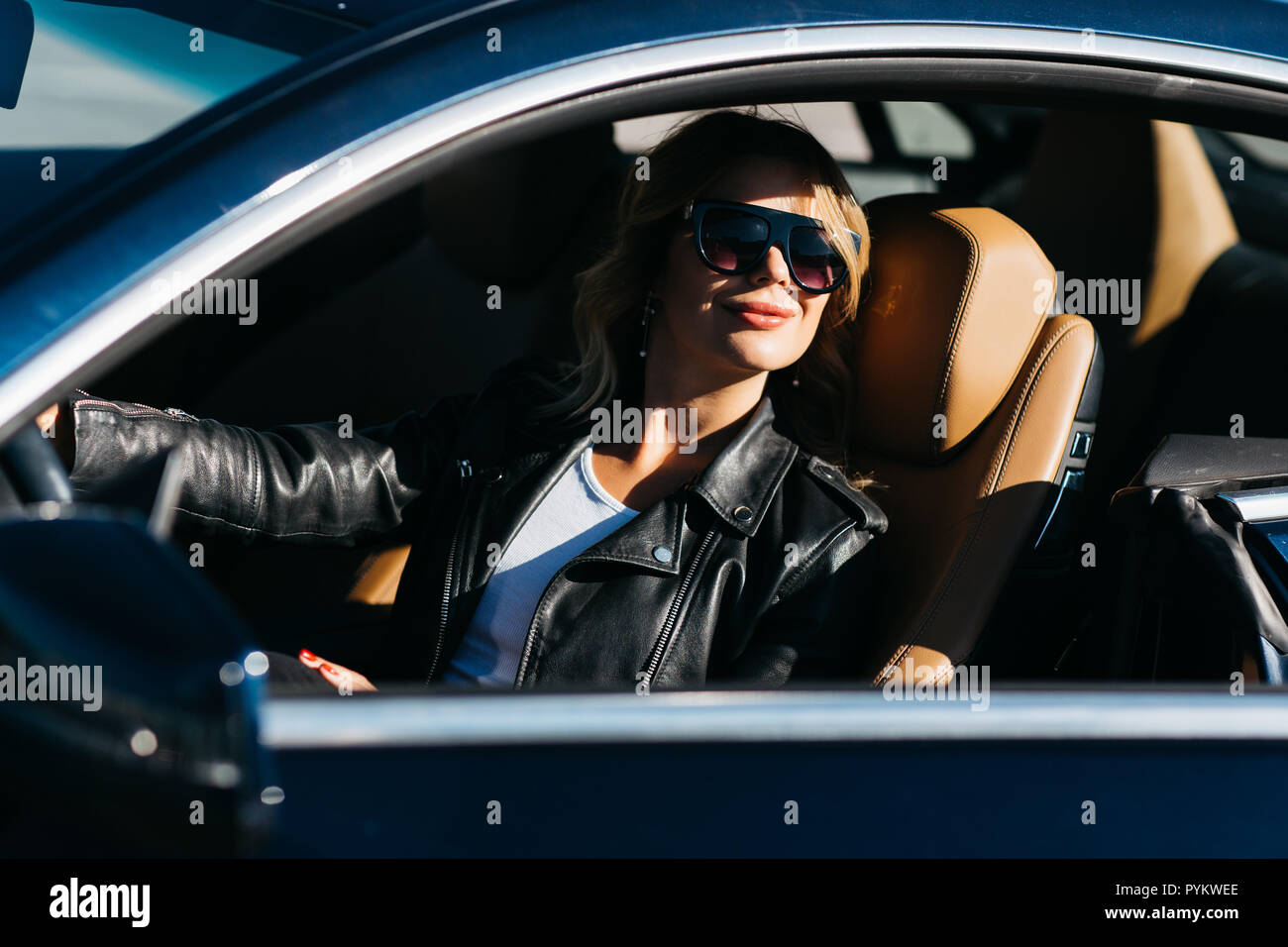 Girl behind steering wheel hi-res stock photography and images - Alamy