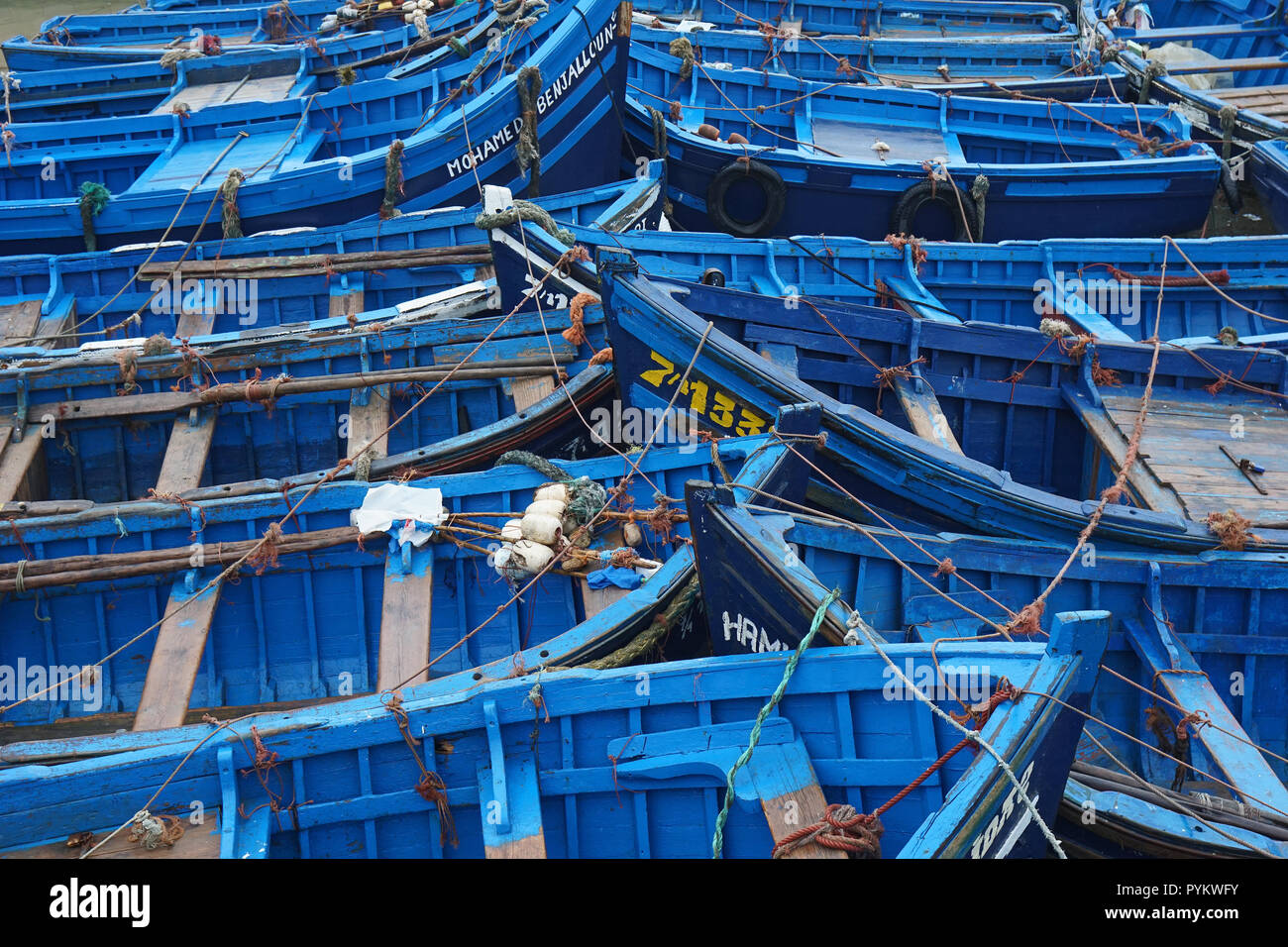 Blue wooden fishing boats in fishing port of Essaouira, Morocco, Africa Stock Photo